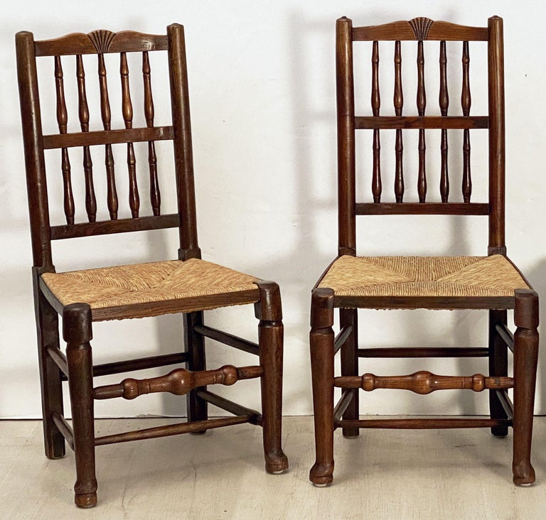 Set of Four English Oak Spindle Back Chairs with Rush Seats at 1stDibs