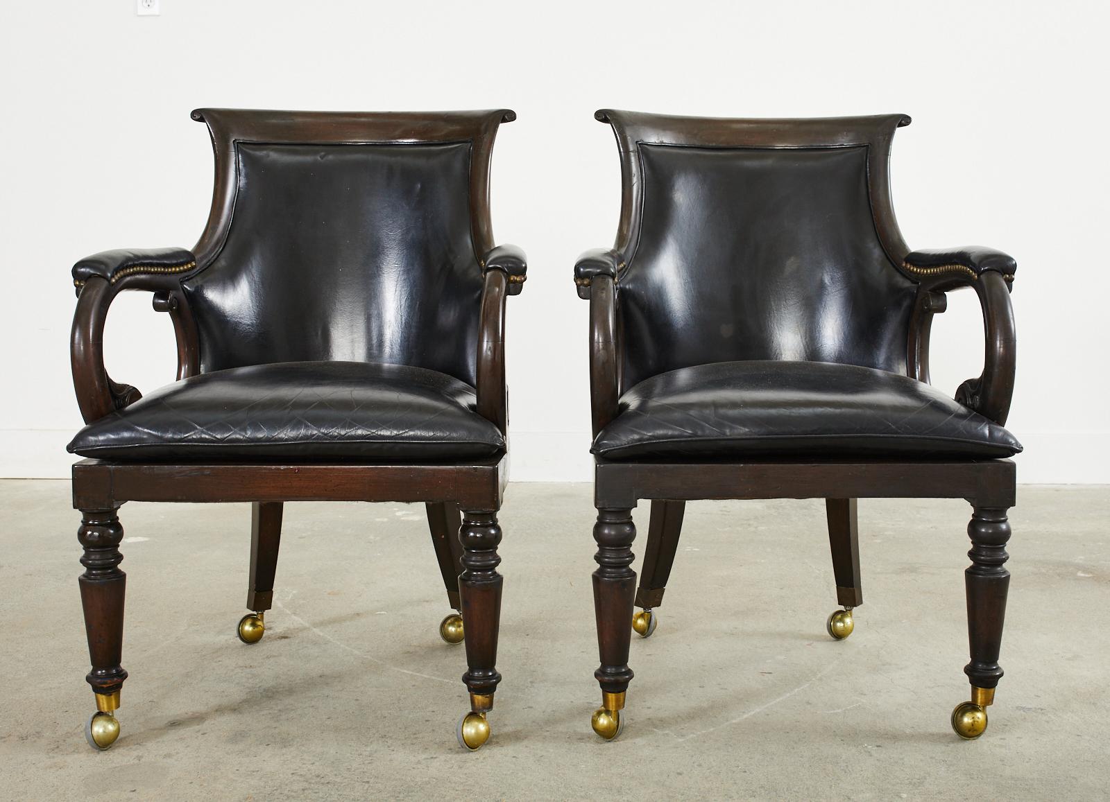 Patinated Set of Four English Regency Style Leather Library Armchairs