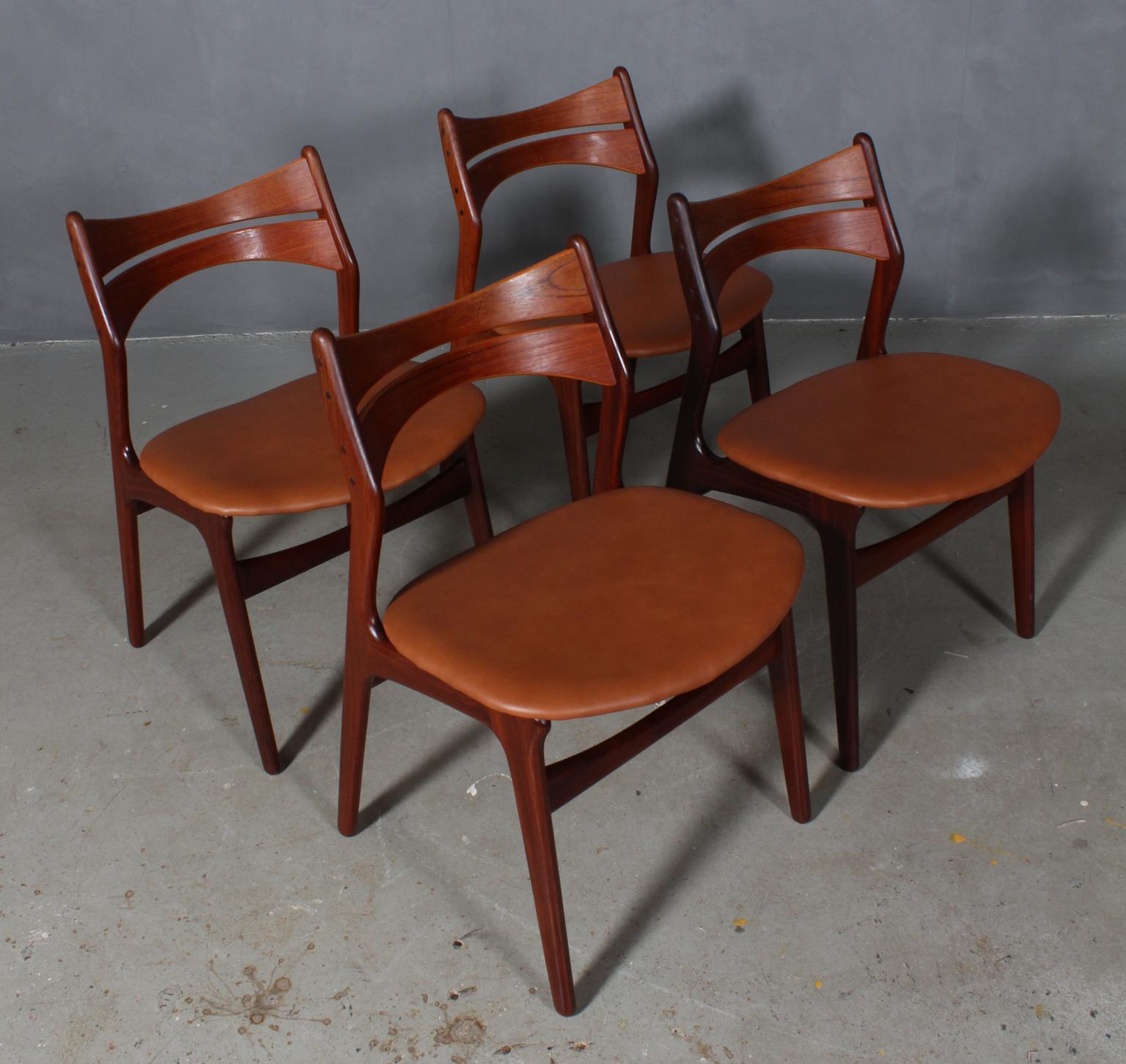 Four Eric Buch chairs with frame of partly solid teak.

New upholstered with tan aniline leather. 

Model 310, made by Chr Christensens Møbelfabrik, Denmark.