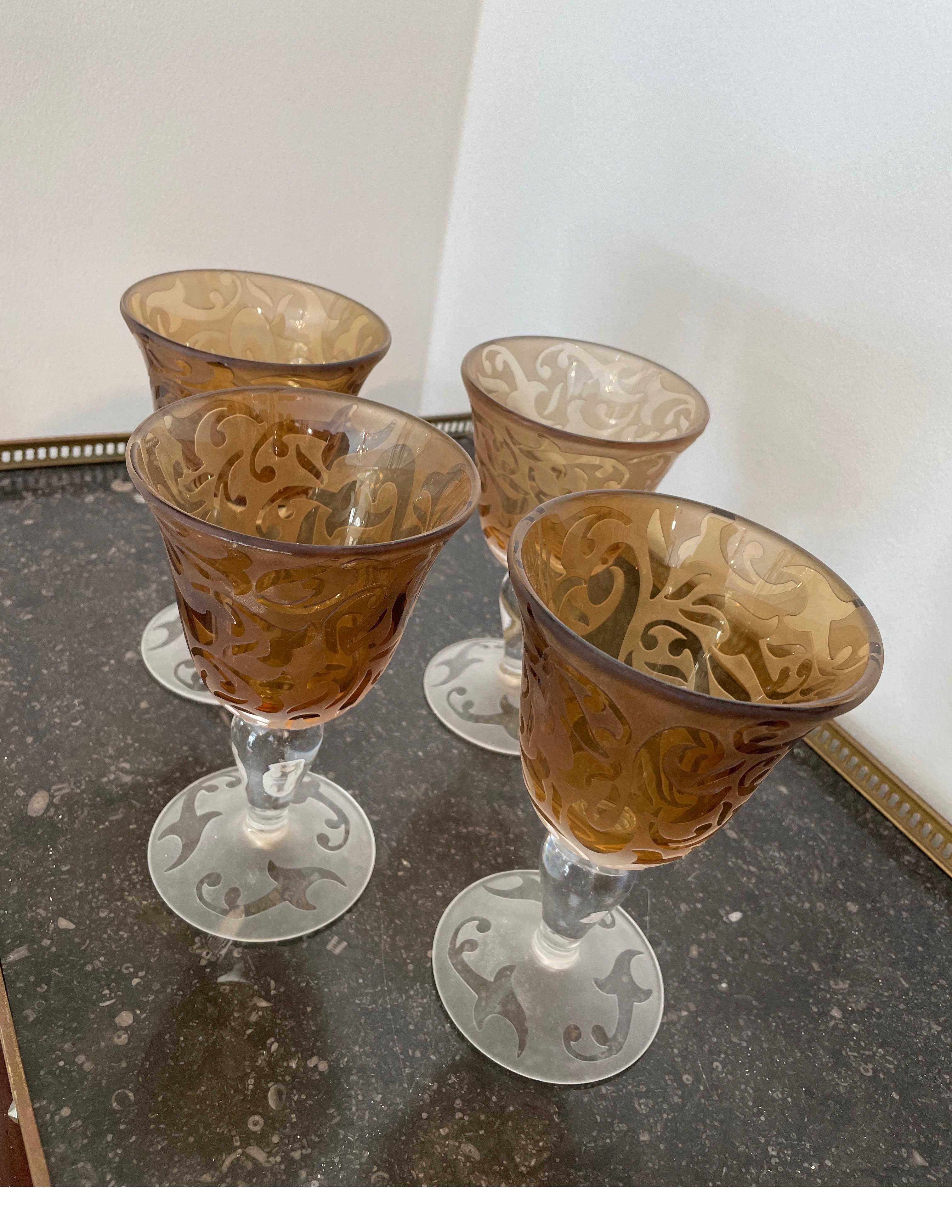 Set of four amber etched art glass goblets by Michael Weems.