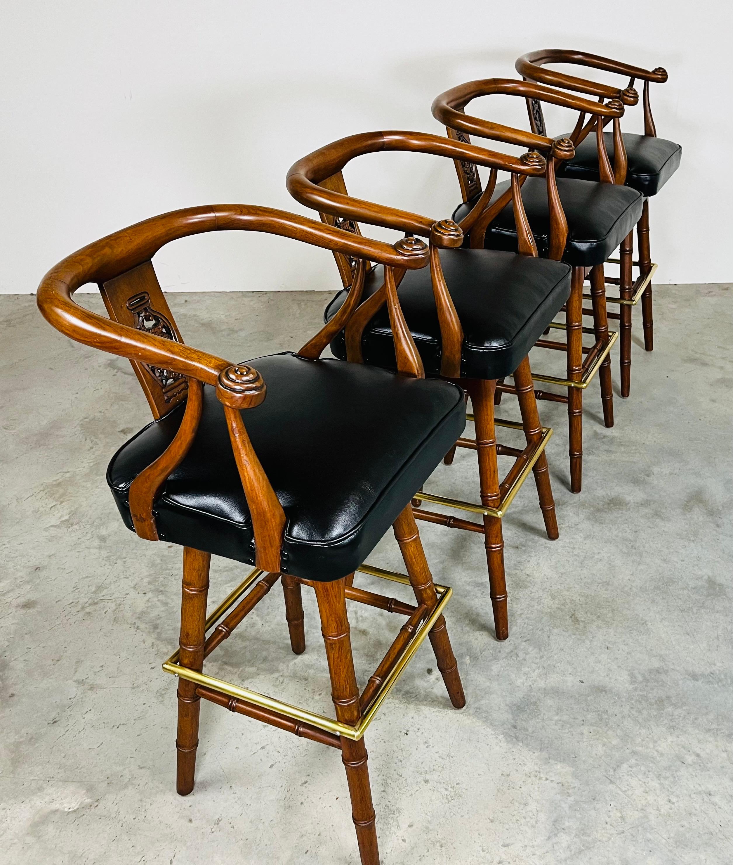 A beautiful set of 4 hand carved mahogany Asian style barstools in the manner of the Edward Wormley for Dunbar 