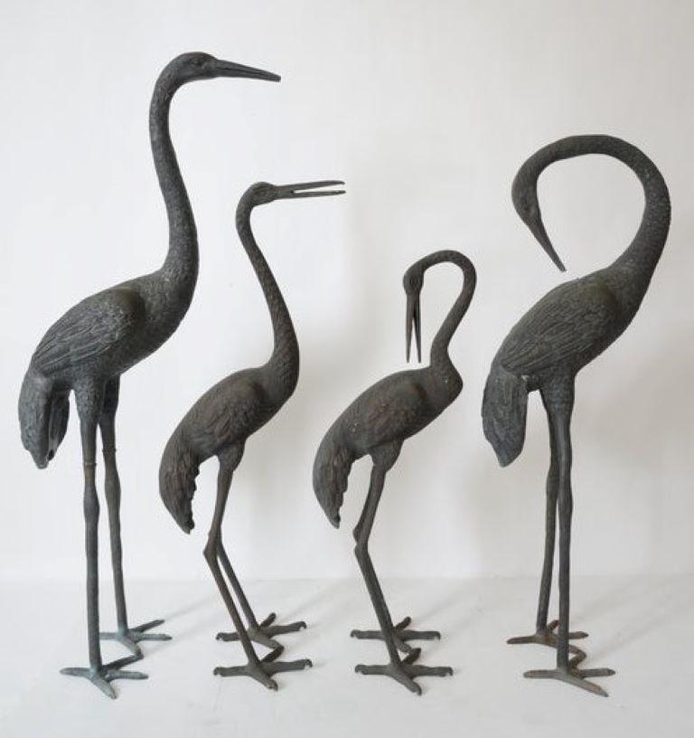 This stylish and chic four piece set of cranes would have been very much in place in the world of Tony Douquette and they will make a beautiful addition to your garden or koi pond.

The set has a an antique Verdi finish that will continue to age