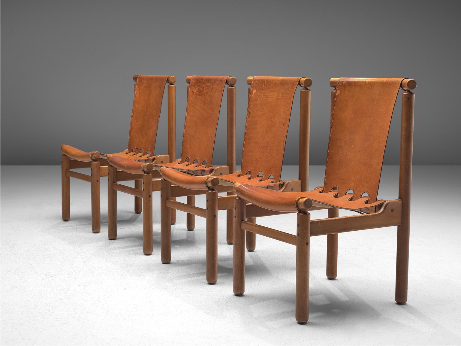 Dining chairs, wood and leather, Finland, 1950s.

These robust chairs feature a geometric, sturdy frame. Yet they feature a certain spaciousness thanks to the decorative opening on the bottom of the backrest. The joints are all very visible, which