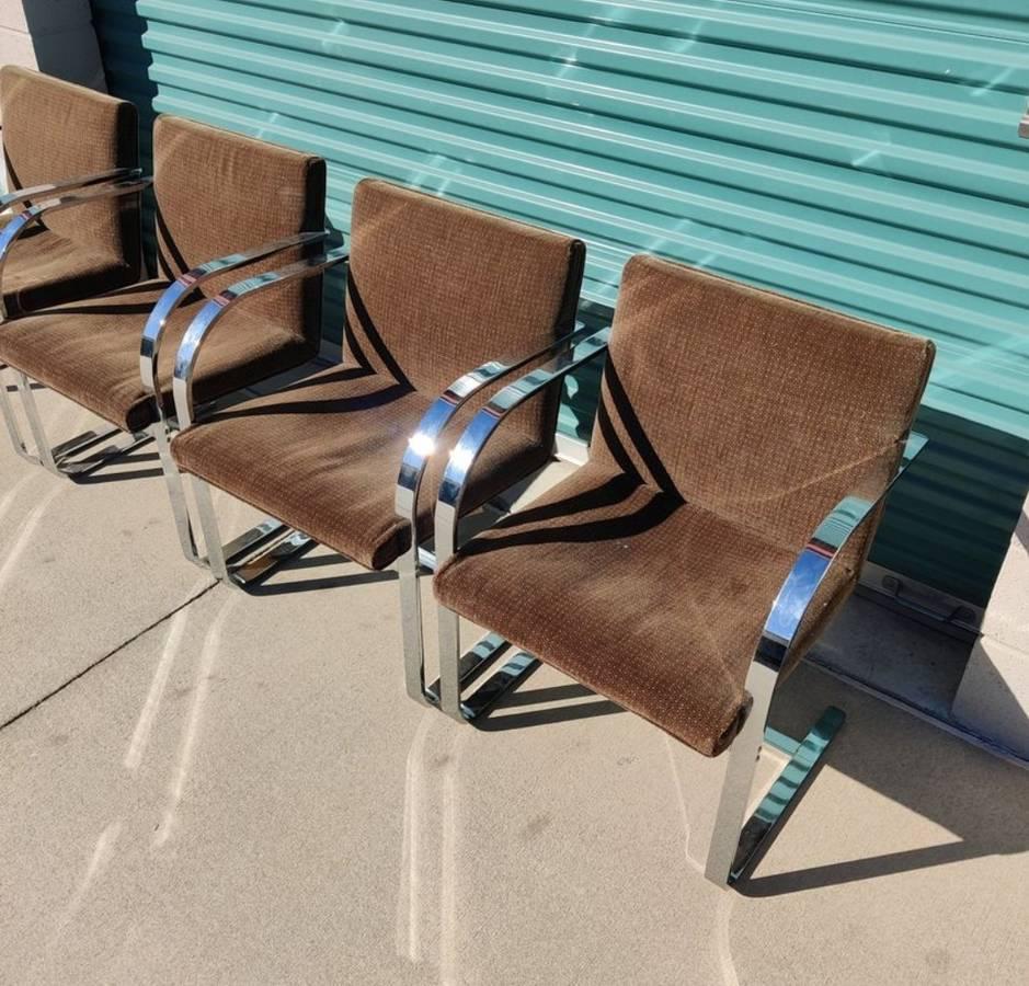 Now available is a set of 4 Brno chairs originally designed by Ludwig Mies Van Der Rohe and Lilly Reich but manufactured by Thonet. Some wear on the fabric.

Height: 30.5 in. (77.47 cm)
Width: 21.5 in. (54.61 cm)
Depth: 23 in. (58.42 cm)
Seat