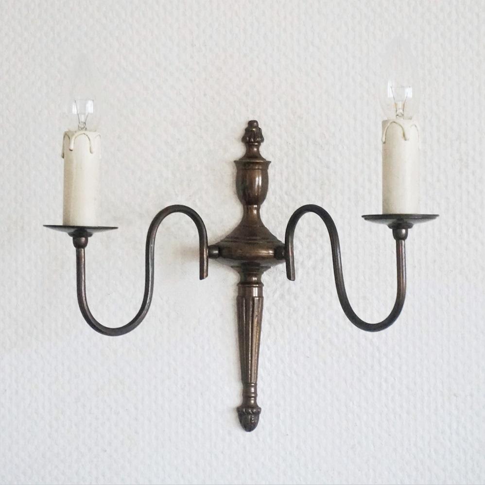 Dutch Colonial Set of Four Flemish Style Brass Two-Light Wall Sconces