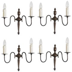 Set of Four Flemish Style Brass Two-Light Wall Sconces