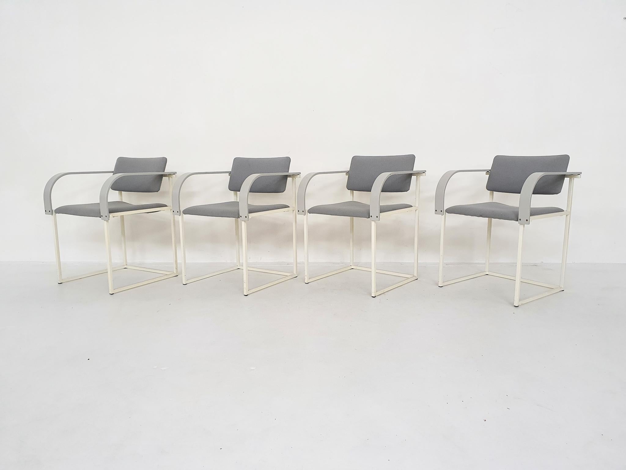 Set of four FM80 dining chairs by Pierre Mazairac and Karel Boonzaaijer, for Pastoe, The Netherlands 1980's
White metal dining chairs with grey wooden arm rests, and original grey upholstery.
Some traces of use to the fabric and frame.