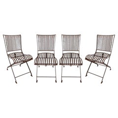 Ensemble de quatre chaises de jardin pliables en fer