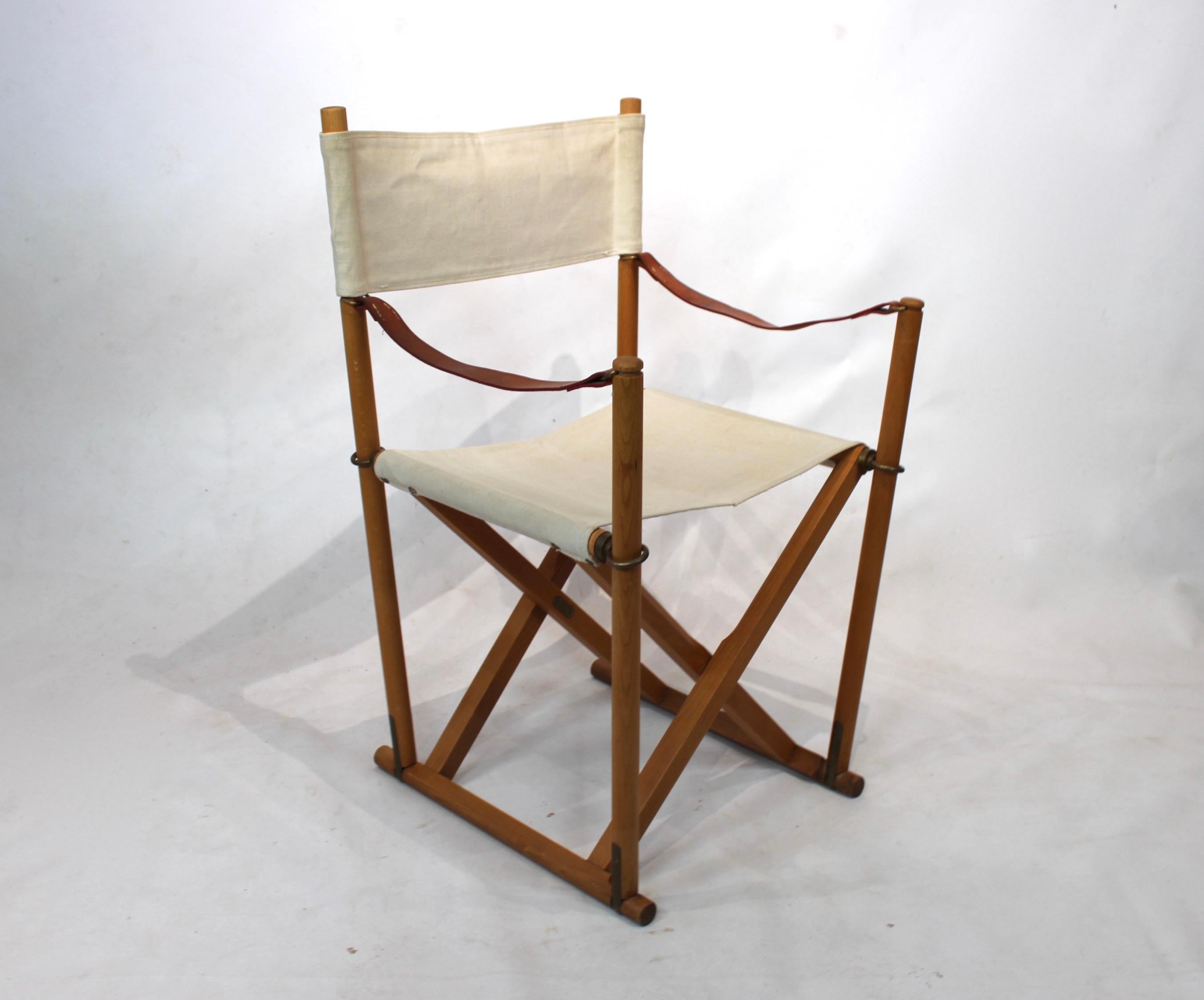 Set of four folding chairs, model MK99200, designed by Mogens Koch. The chairs are of beech and light nature canvas.