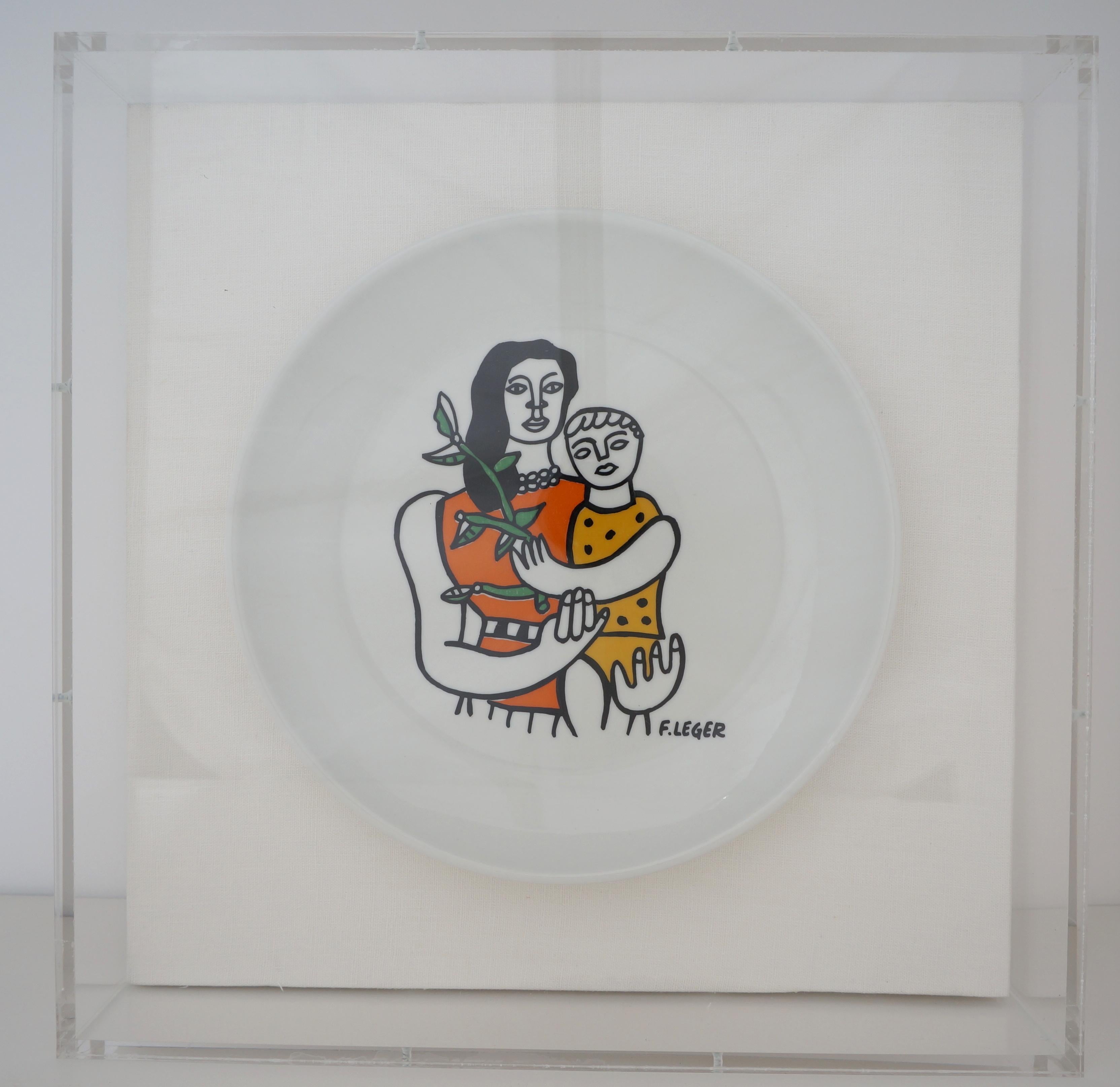 This stylish and chic set of four porcelain plates date to the 1970s and have been professionaly framed as of March 2021 in custom lucite shadow boxes and mounted on a white woven fabric. The pieces are marked on the verso Editions S.E.A.L