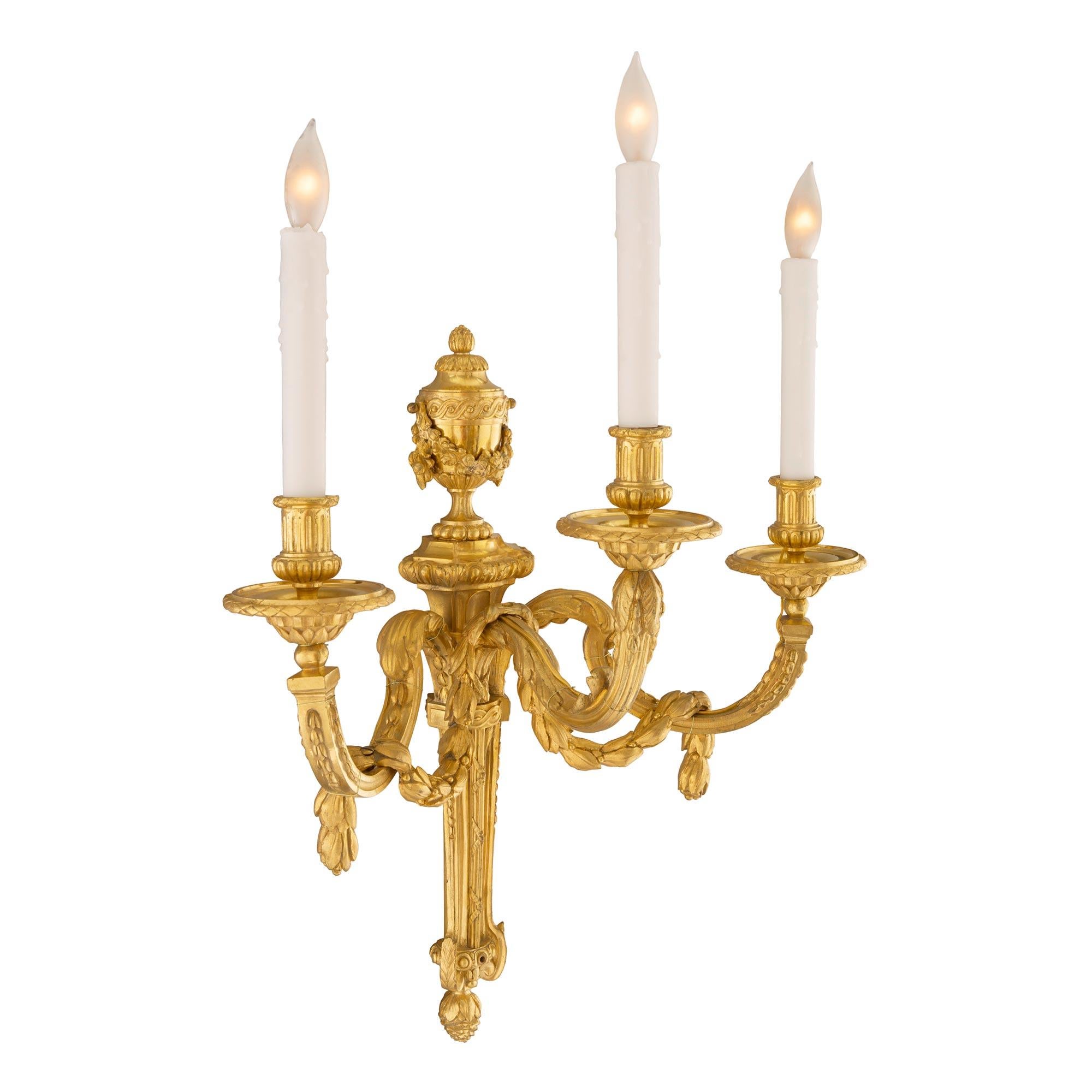 Set of Four French 19th Century Louis XVI Style Three-Light Ormolu Sconces In Good Condition For Sale In West Palm Beach, FL