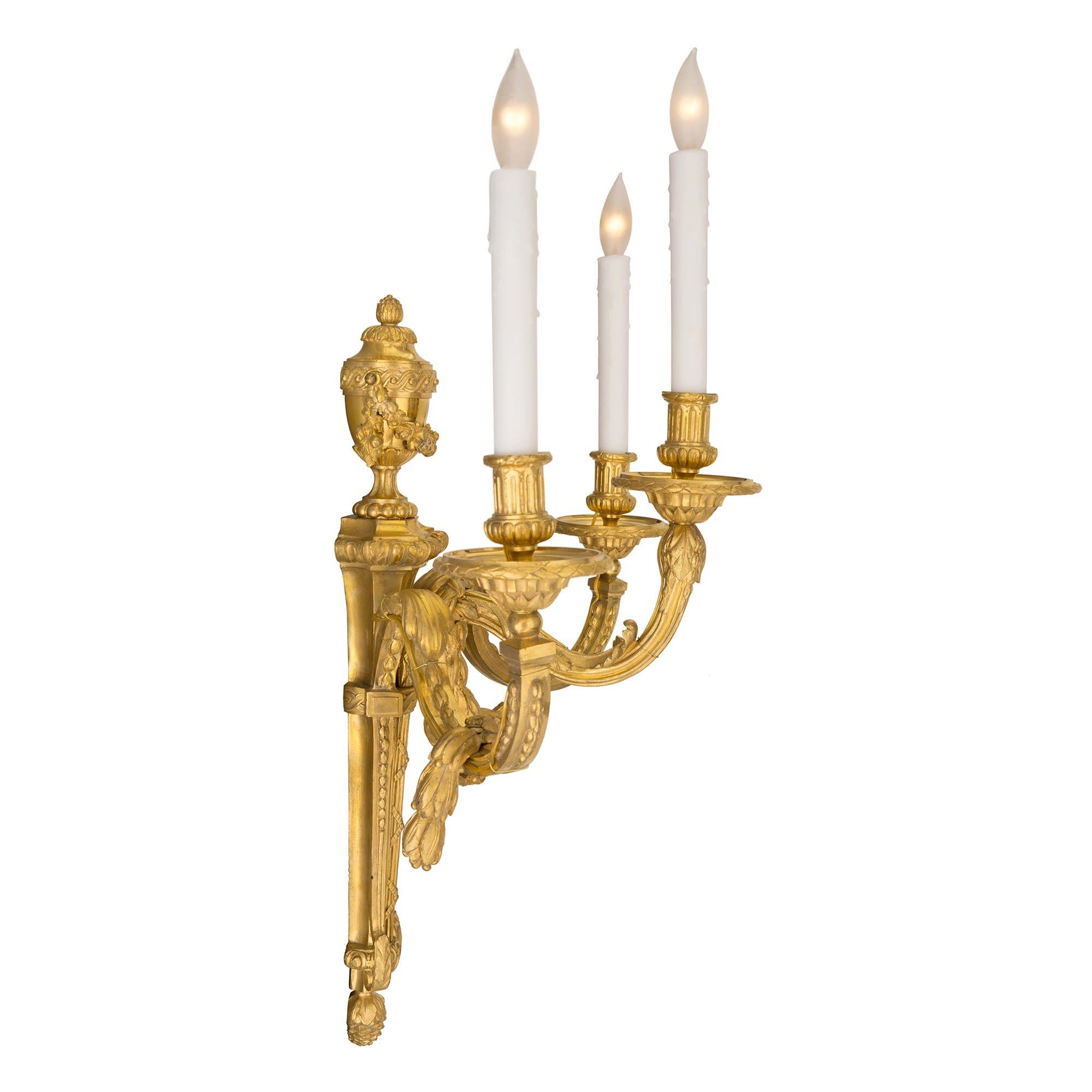 Set of Four French 19th Century Louis XVI Style Three-Light Ormolu Sconces For Sale 1