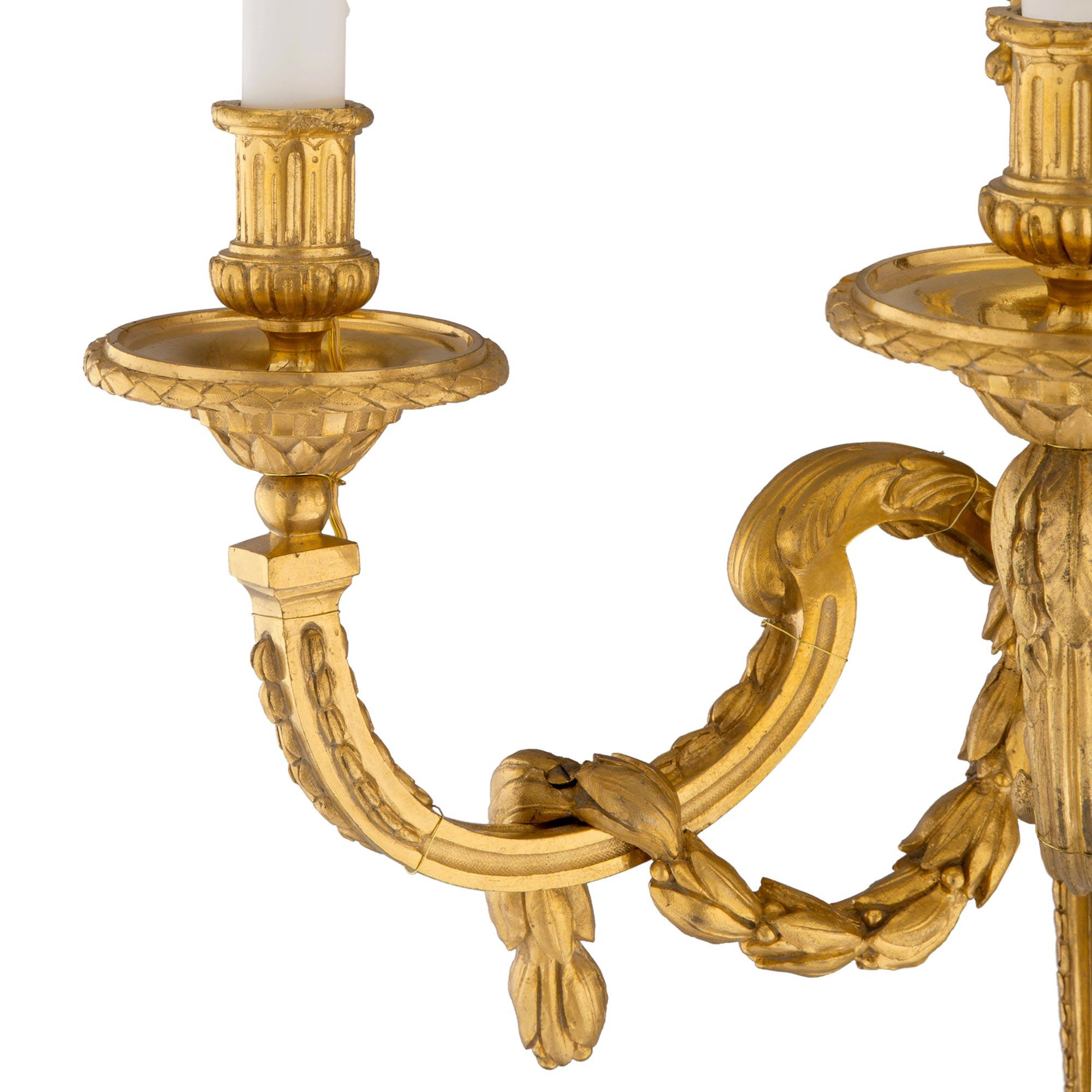 Set of Four French 19th Century Louis XVI Style Three-Light Ormolu Sconces For Sale 3