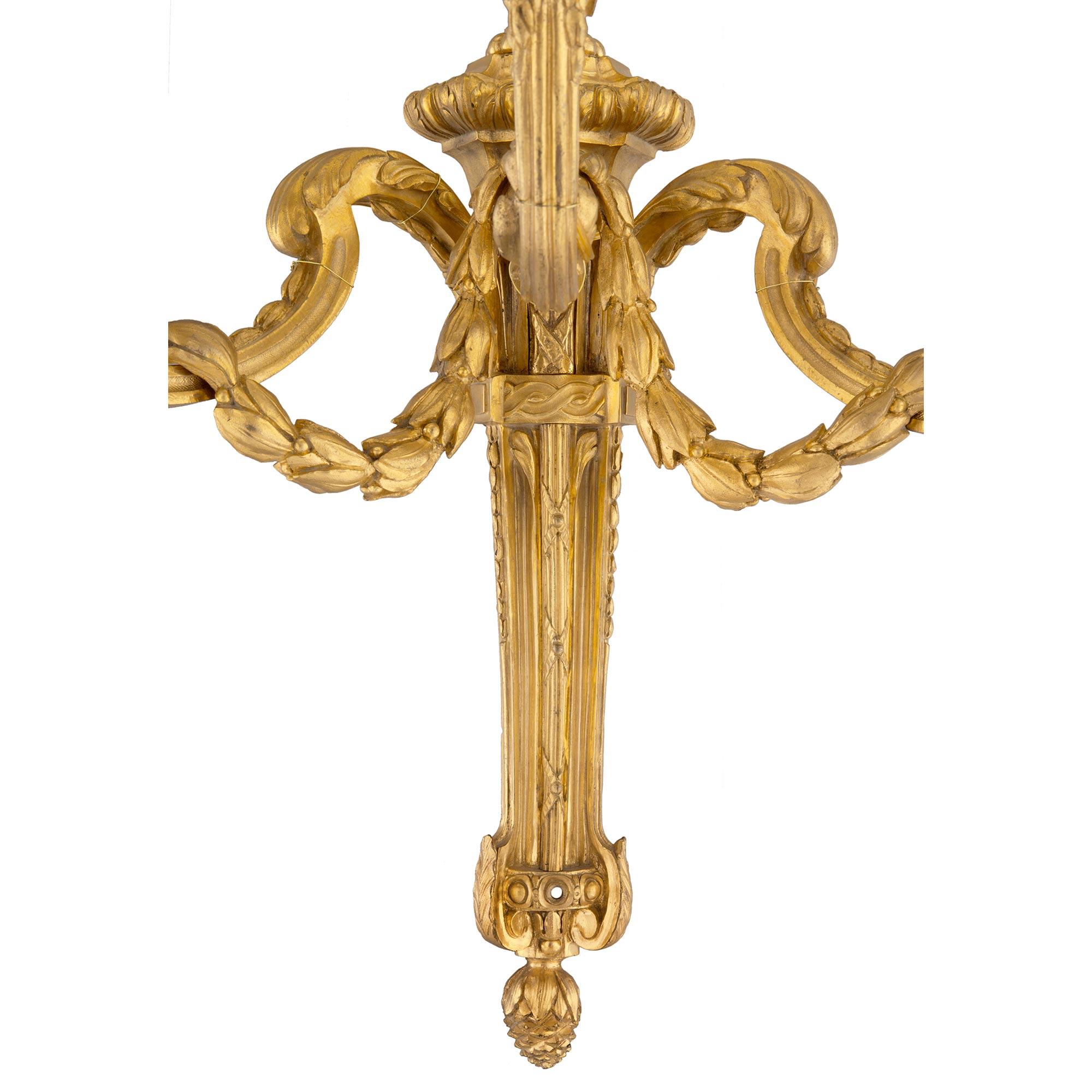 Set of Four French 19th Century Louis XVI Style Three-Light Ormolu Sconces For Sale 4