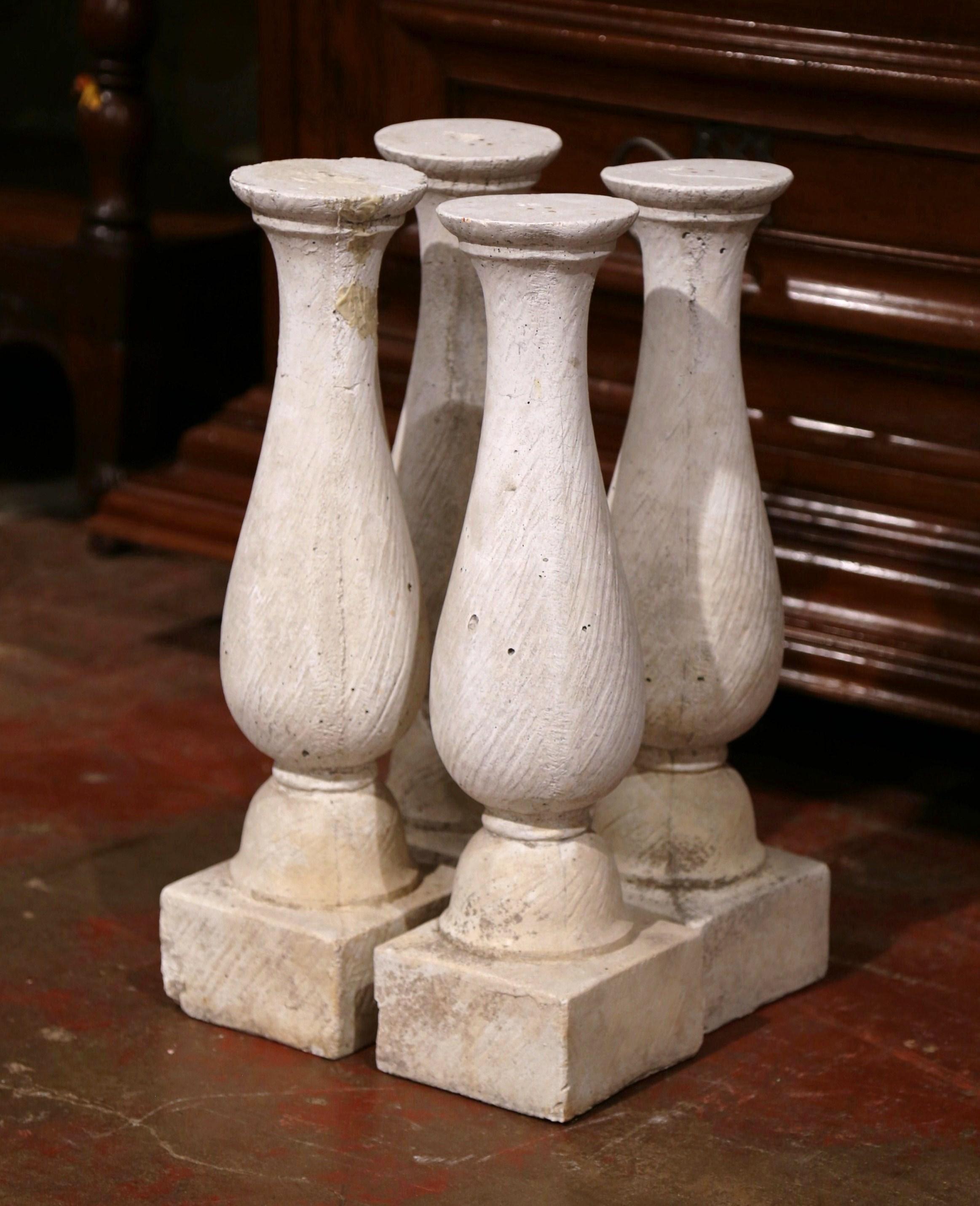 These antique balusters were created in Southern France, circa 1880; made of cast stone, each piece is hand-carved with the original patinated finish. All four pieces are in good condition commensurate with age and use. Convert these elegant