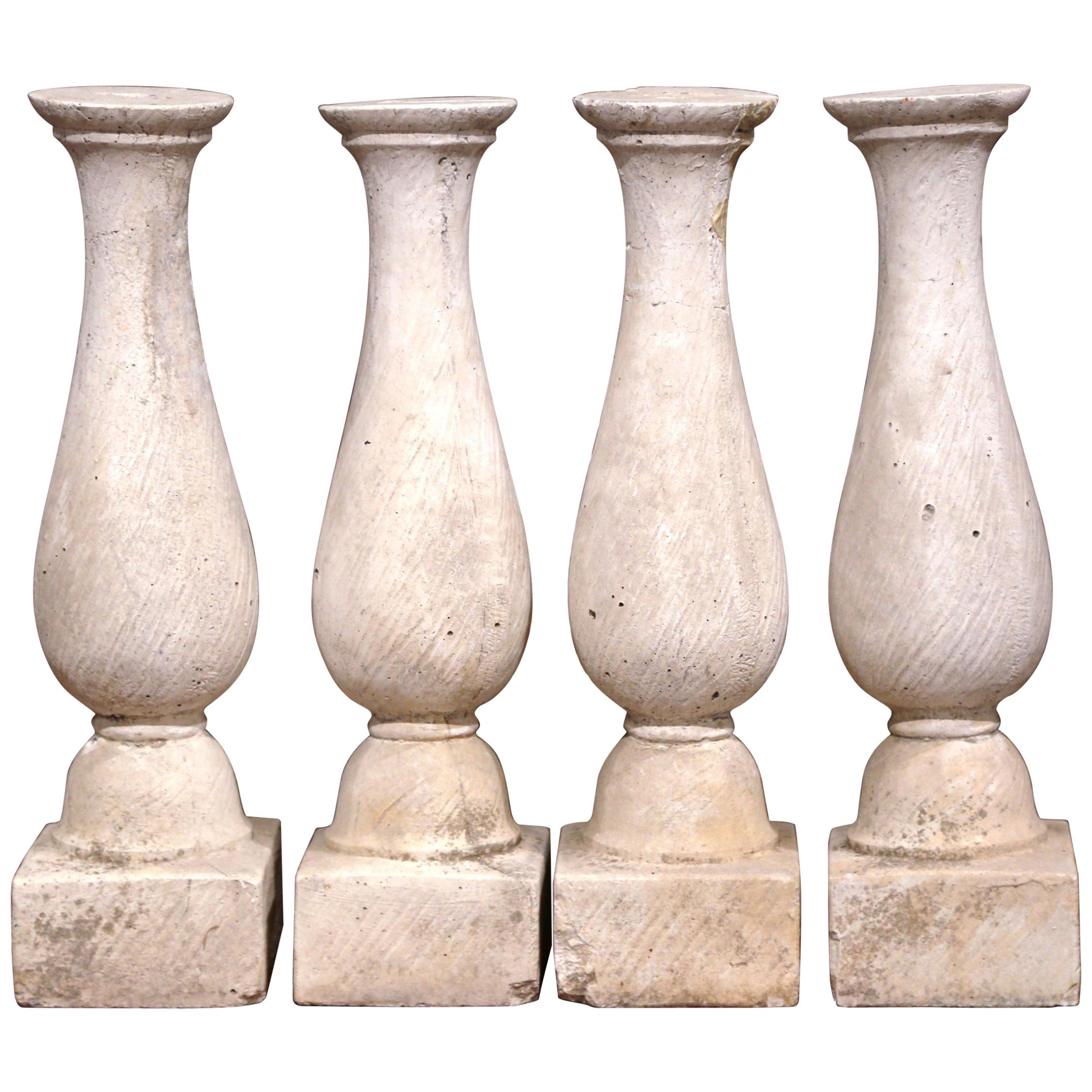 Set of Four French 19th Century Patinated Carved Stone Balusters