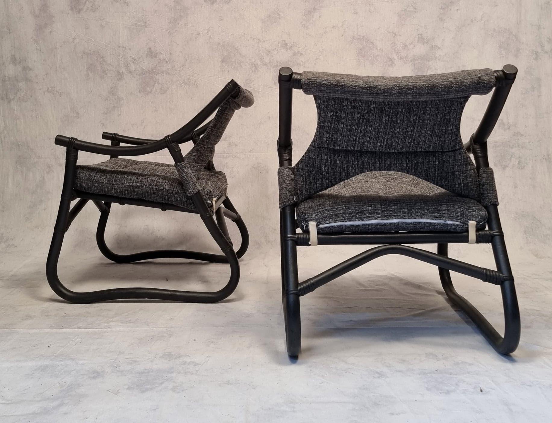Beautiful set of four black lacquered bamboo armchairs. These armchairs are of French origin. The seat and back have been completely redone, upholstery as trim. The gray mottled fabric blends harmoniously with the black of the bamboo. Can be sold in