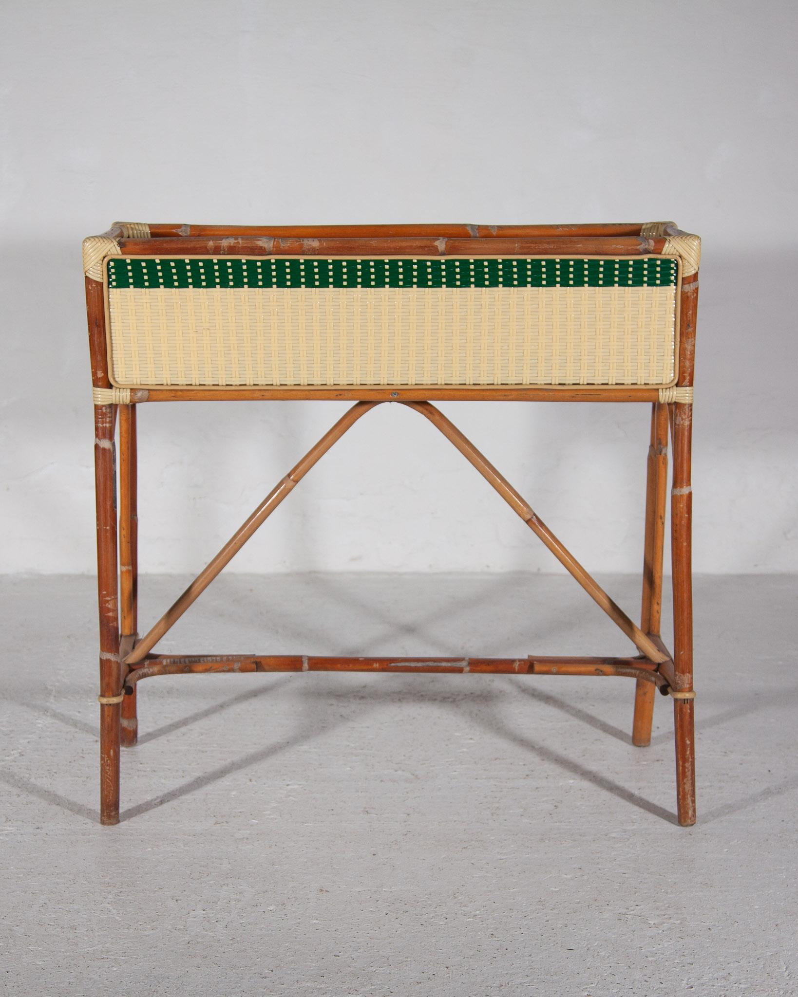 Set of four French bamboo rattan planters by Maison Gatti, 1950s made from a piece of hand-shaped bamboo frame and a rectangular planter with decorative geometric woven resin green and yellow stripes. Made by Parisian artisans since 1920. The