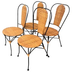 Used Set of Four French Black Painted Metal and Wicker Patio Cafe Chairs