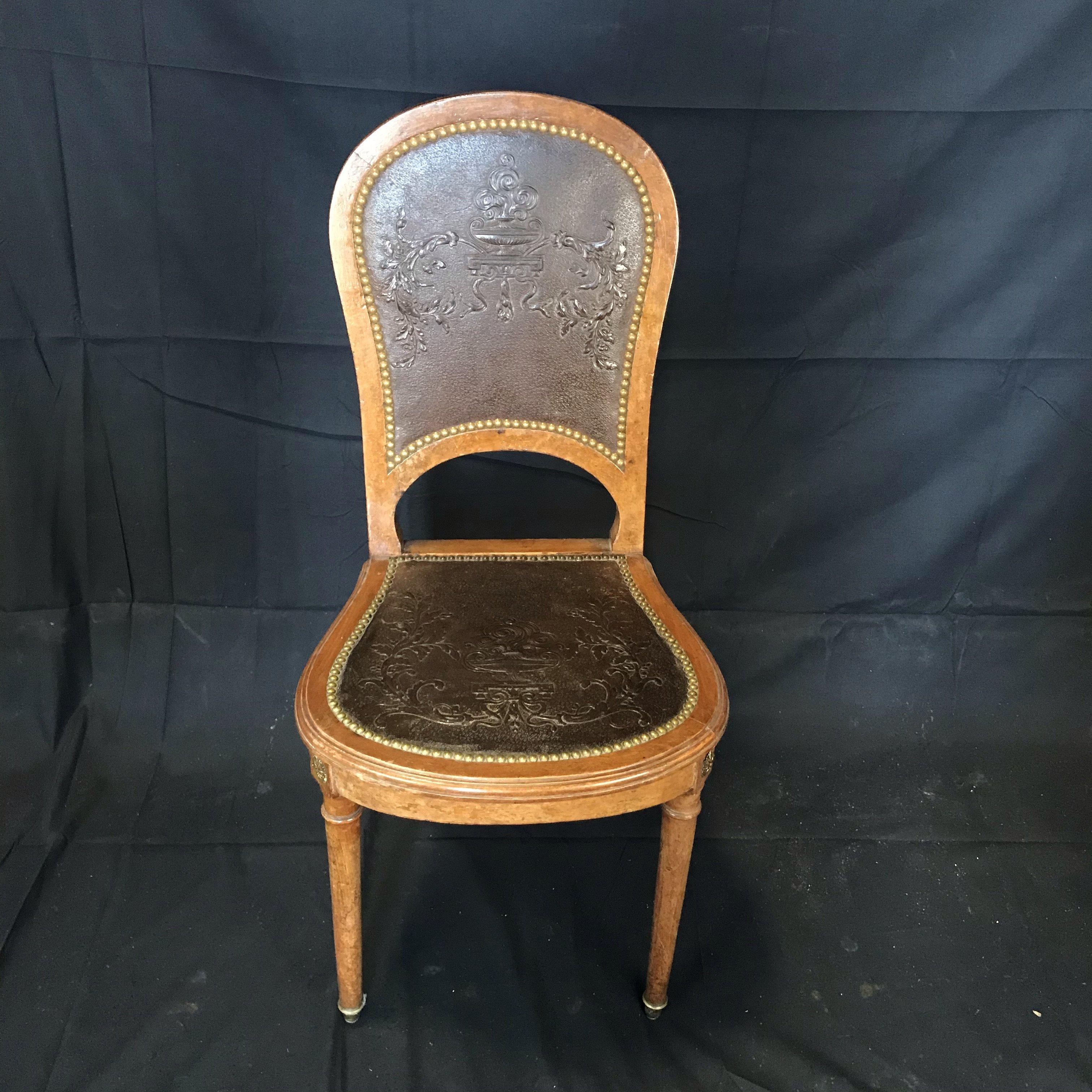 Set of four French burled walnut pressed-back leather chairs with original tacks and bronze florets
Very unusual beautiful set of 4 French burled walnut side dining chairs having amazing pressed back leather chairs with original tacks and bronze