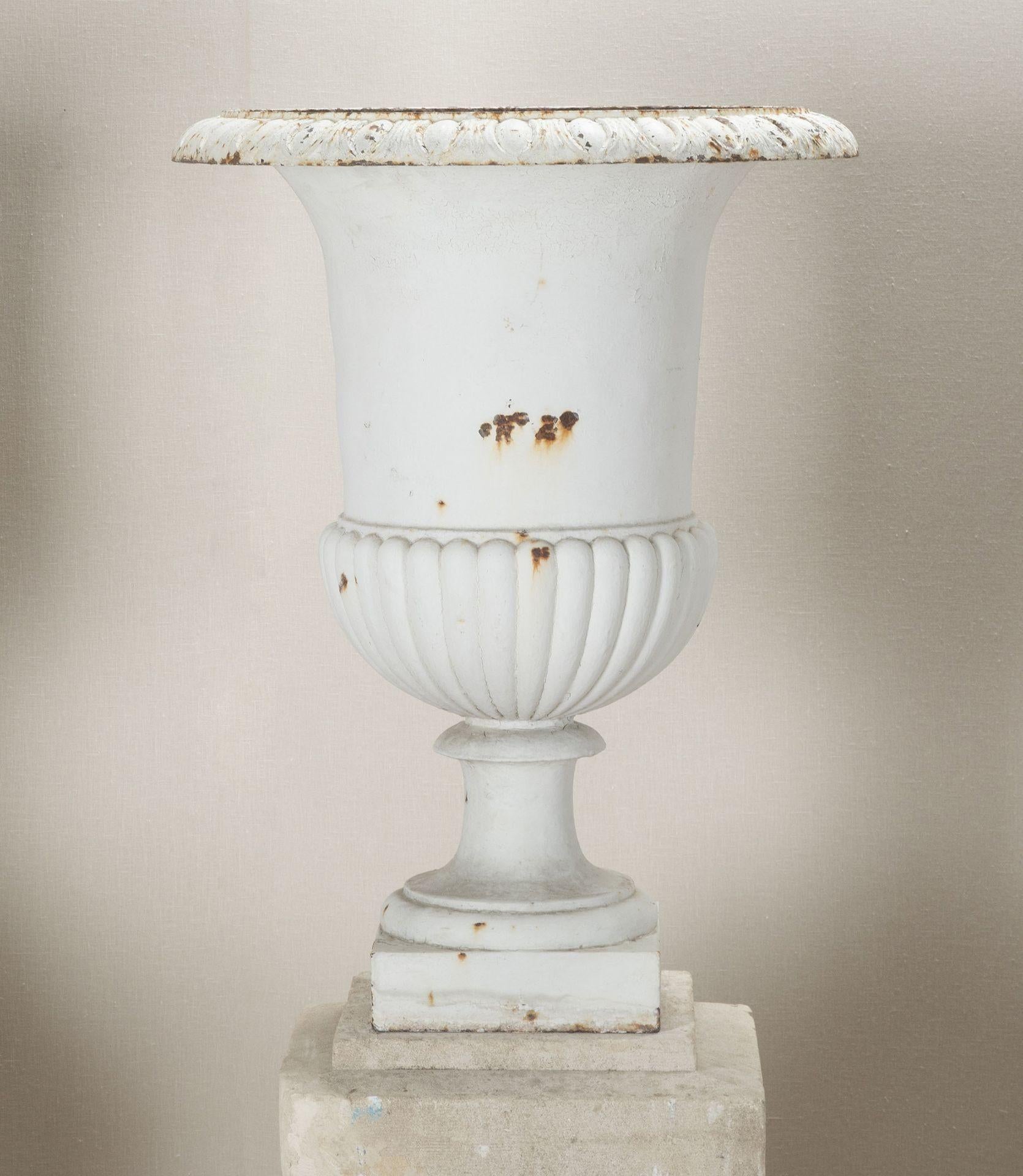 Country Set of Four French Cast Iron Urns on Stone Plinths For Sale