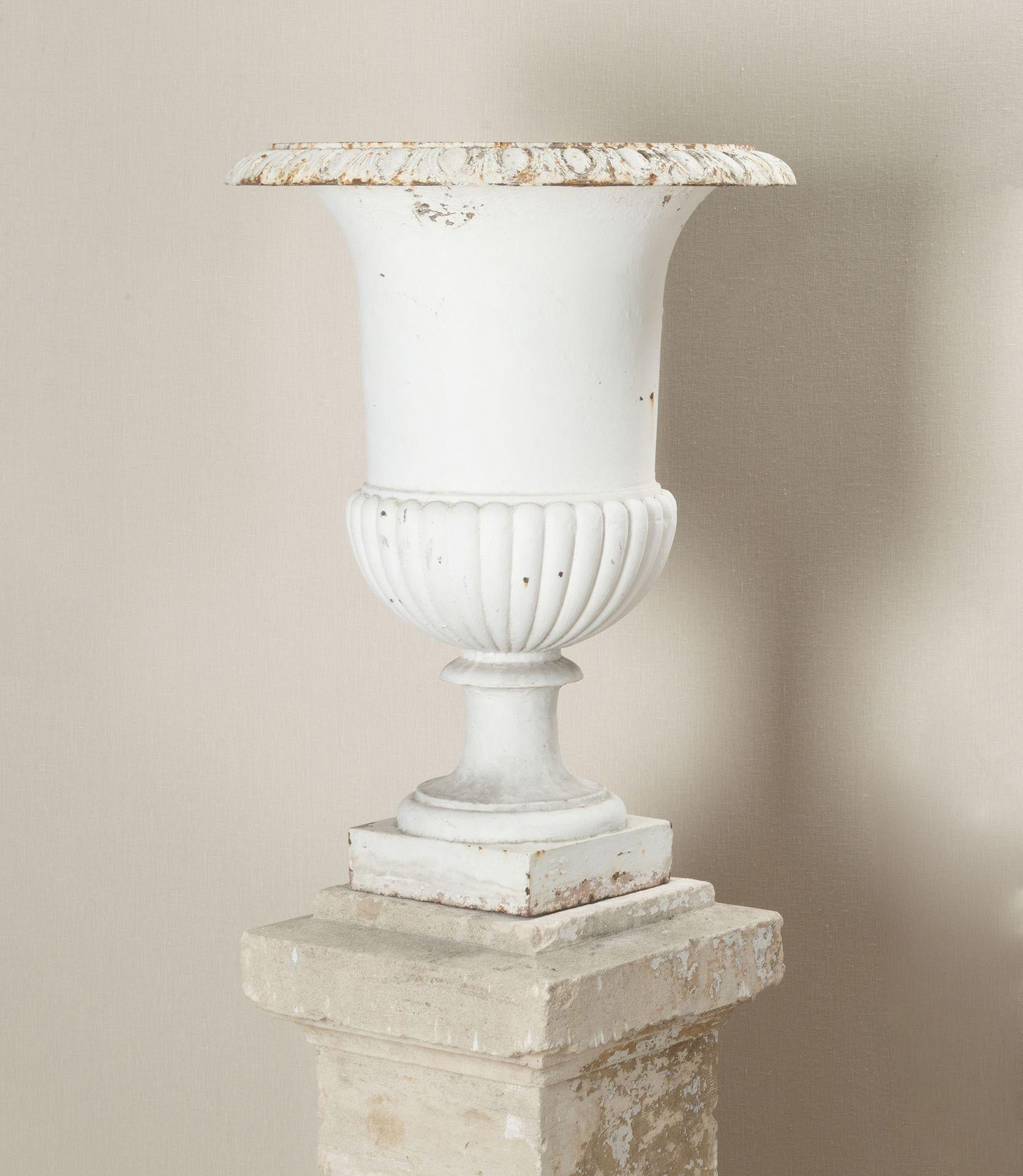 Set of Four French Cast Iron Urns on Stone Plinths In Good Condition For Sale In Gloucestershire, GB