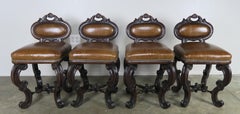 Set of Four Distressed French Leather Armchairs, Circa 1900