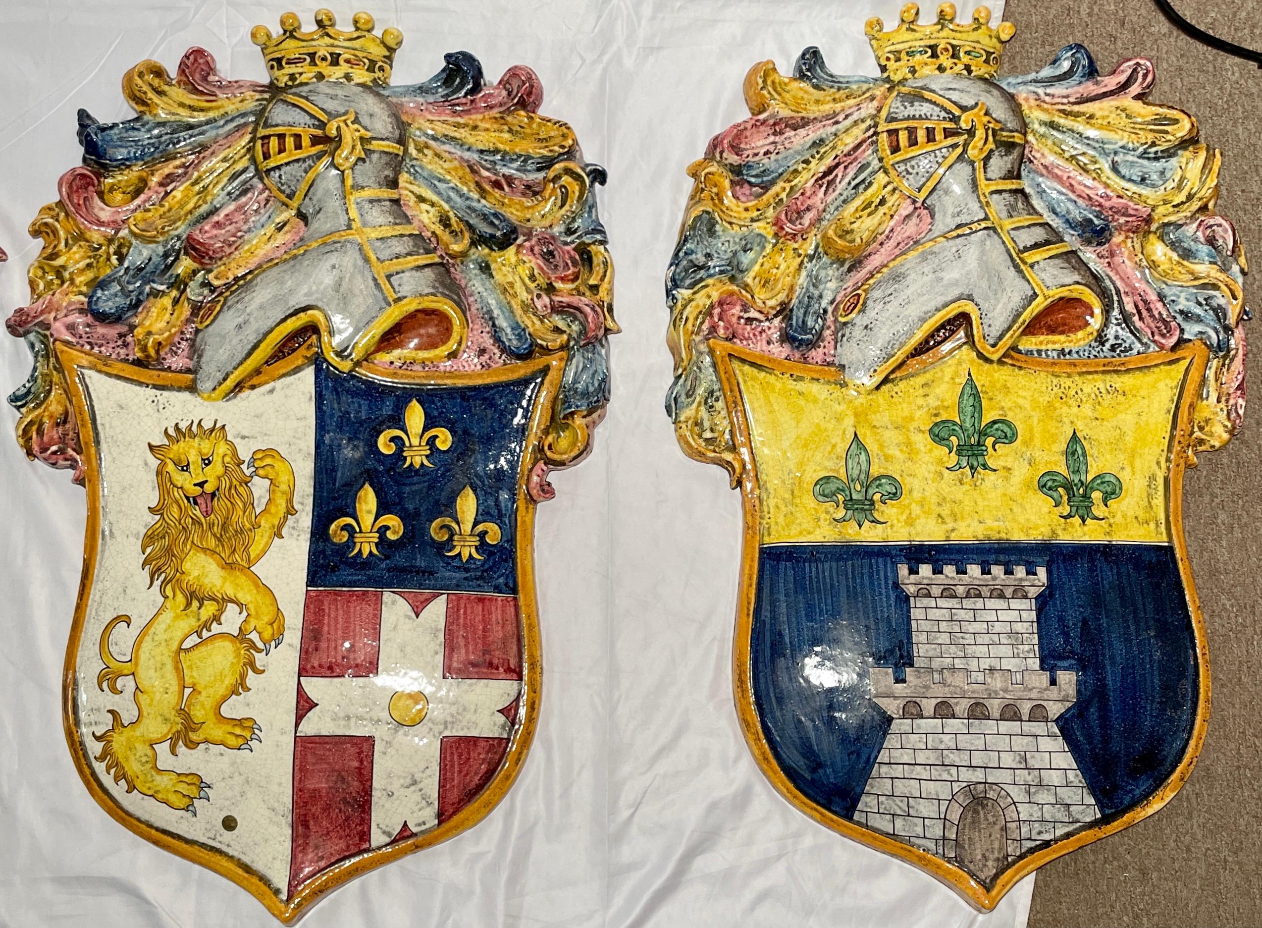 Large size set of four French Faience porcelain colorful coats of arms wall panels.

(Price reflects the set of 4 but may be sold separately).