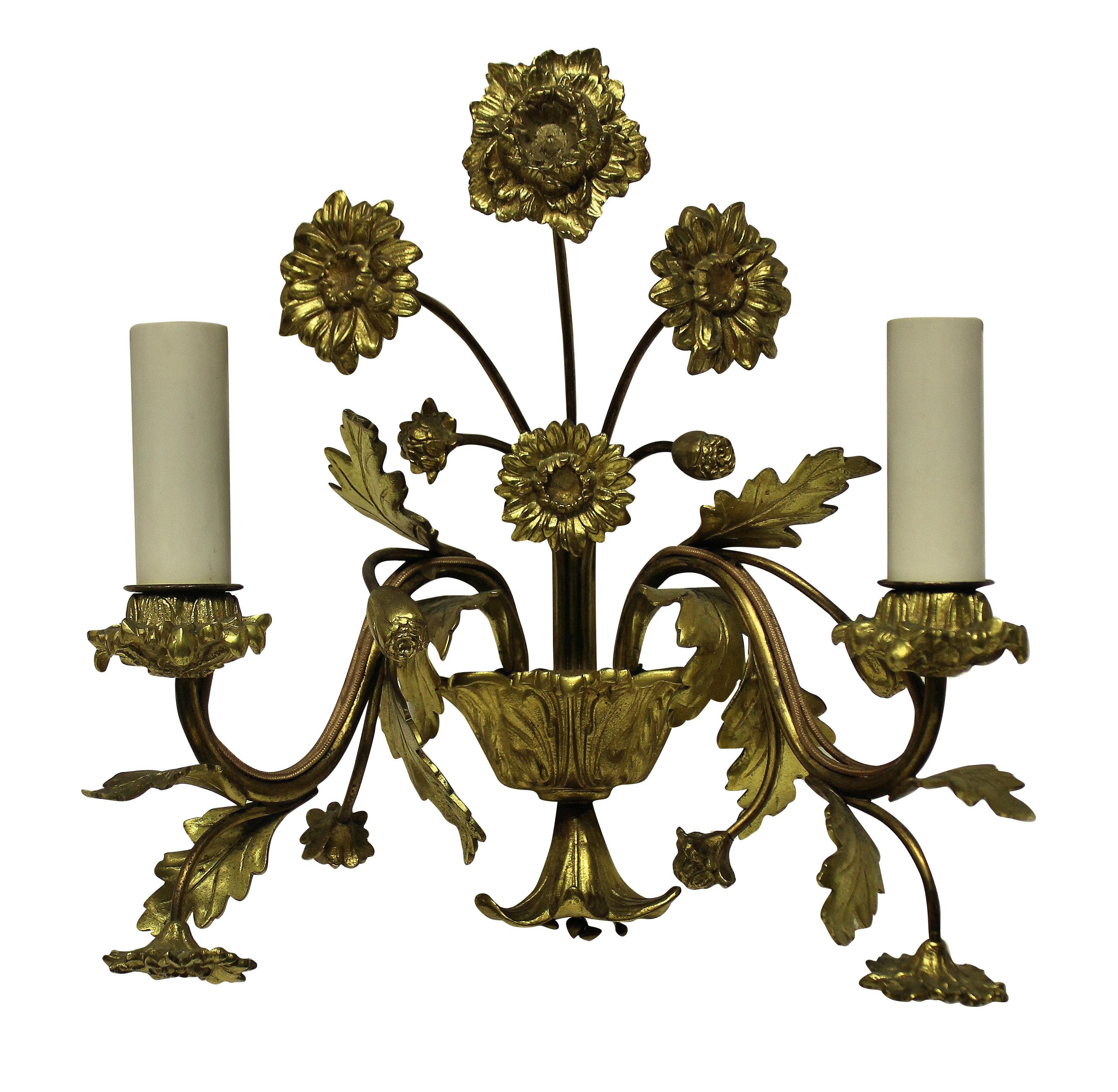 A set of four French gilt bronze wall sconces depicting flowers.