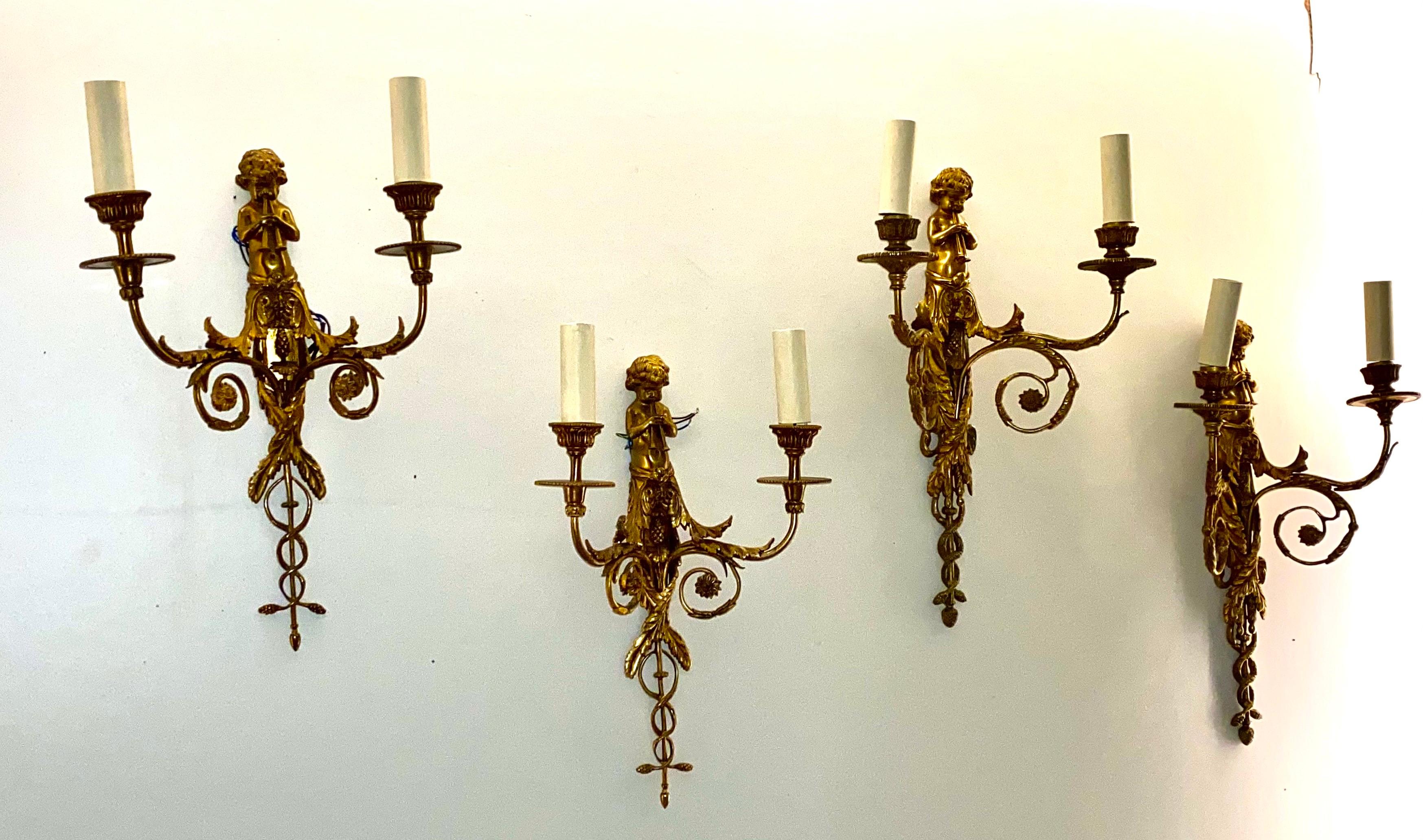 European Set of Four French Gilt Bronze Dore Two Branch Cherub Wall Sconces For Sale