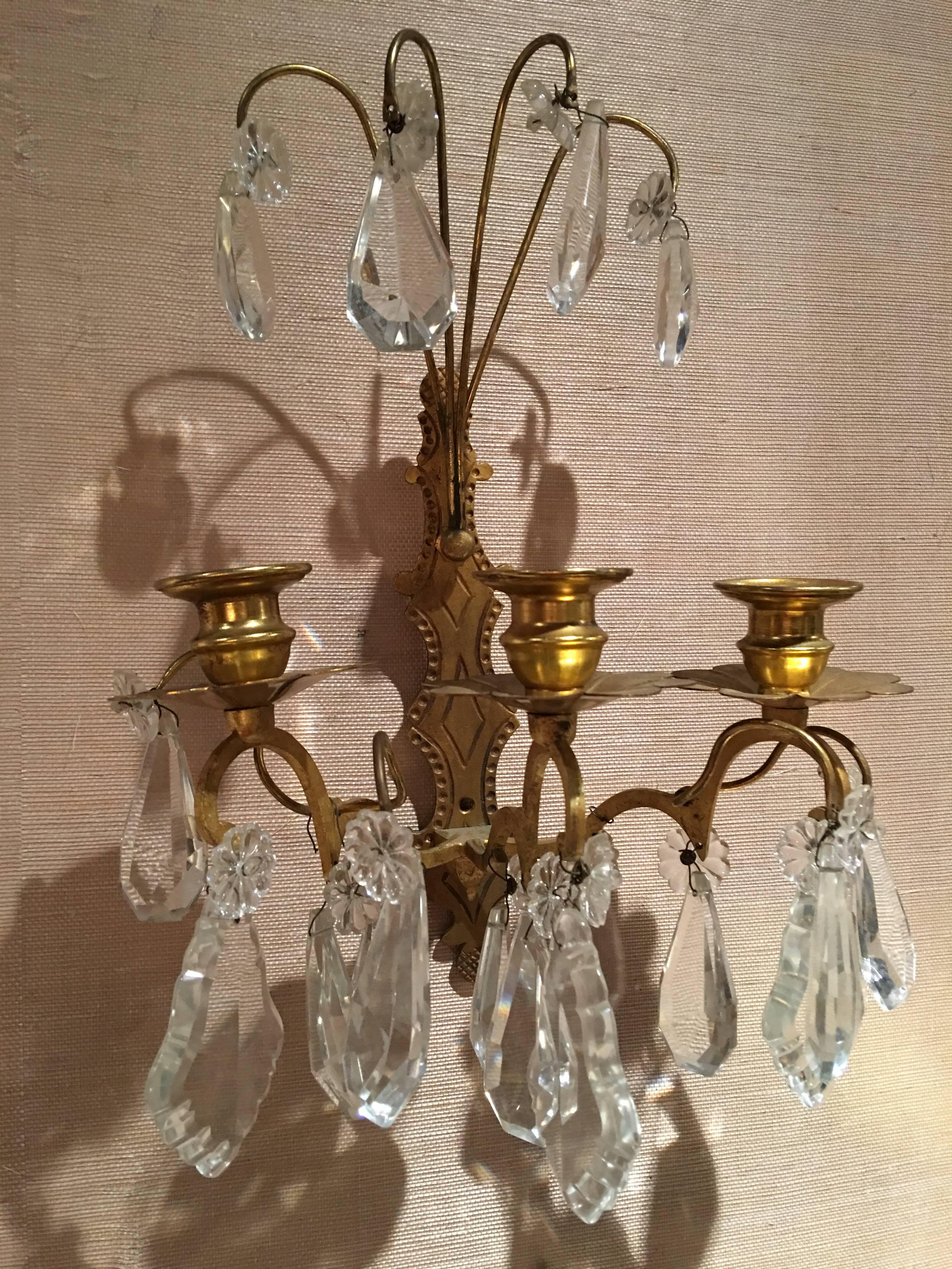 Set of four French gilt metal and crystal sconces, 19th century.