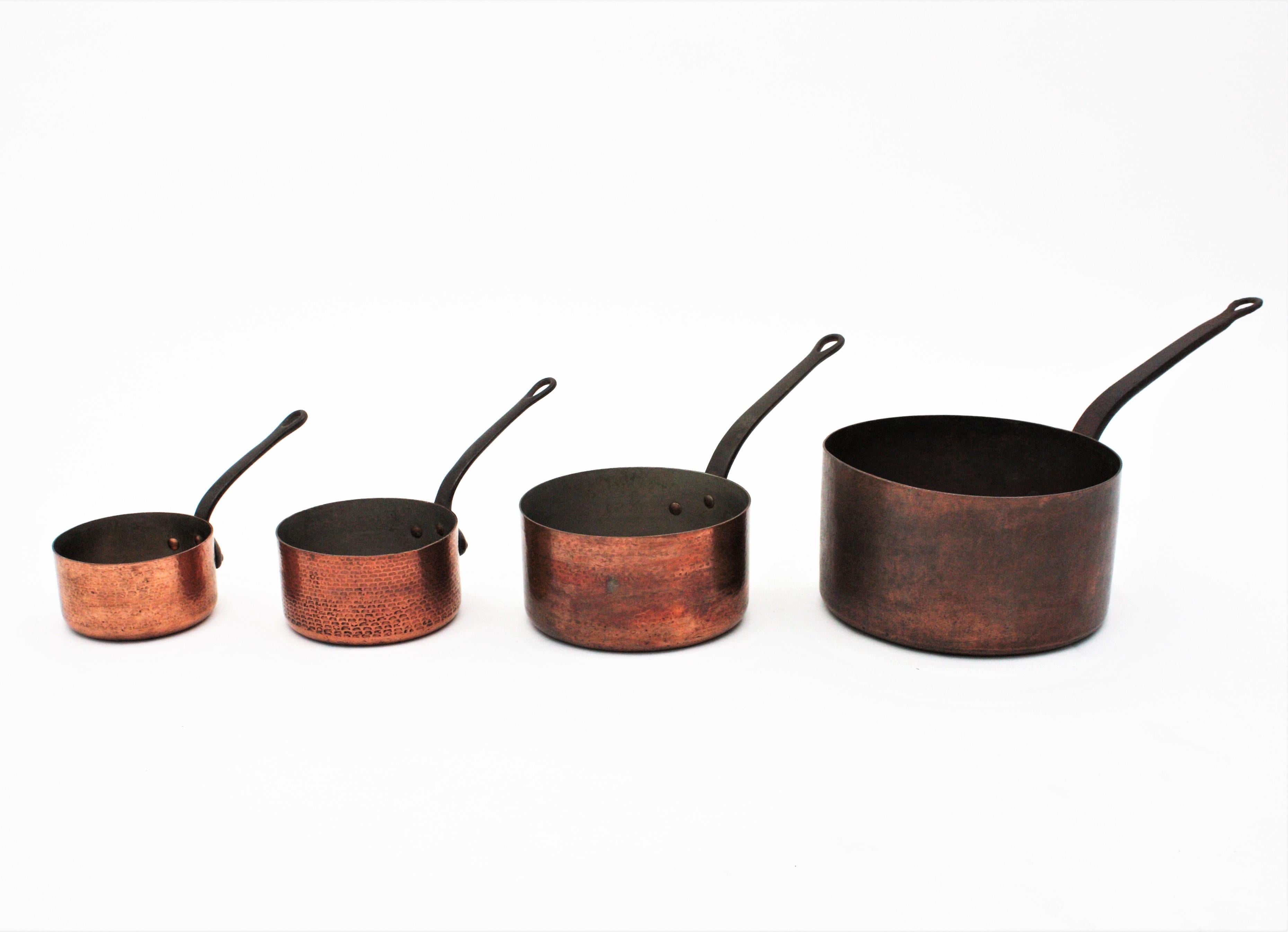Cast Set of Four French Copper Saucepans with Iron Handles, 1940s For Sale