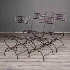 Set of Four French Iron Curule Side Chairs with Woven Strap Seats