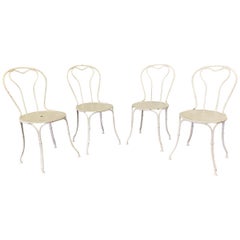 Ensemble de quatre chaises de jardin en fer français