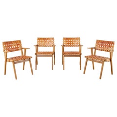 Ensemble de quatre fauteuils de salle à manger à sangles en cuir tissé de style Jens Risom