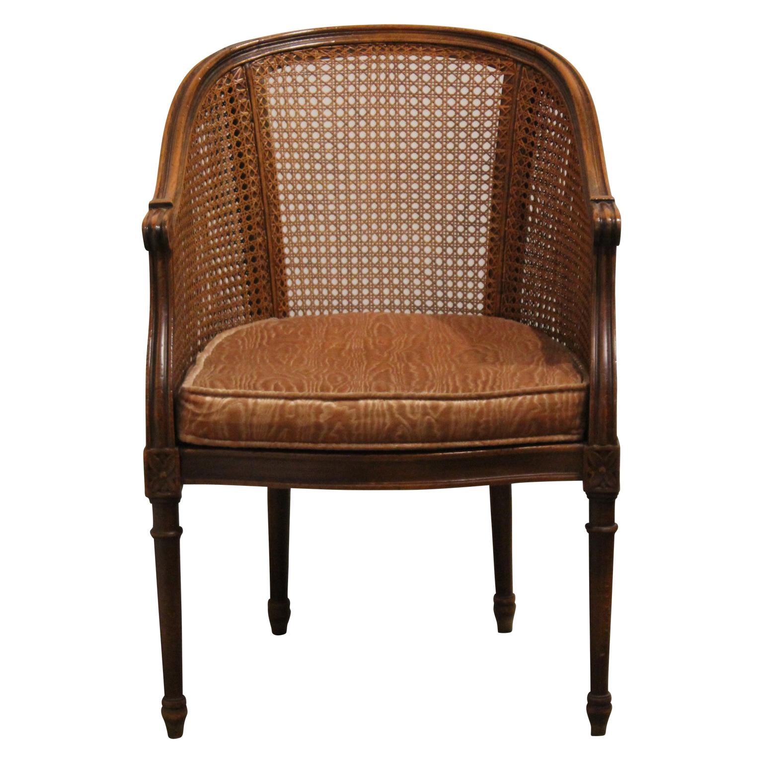 A beautiful set of four French Louis XV cane barrel back chairs. Needs upholstery otherwise in great vintage condition.