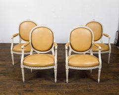 Set of Four French Louis XVI Style 1900s Oval Back Painted and Carved Armchairs