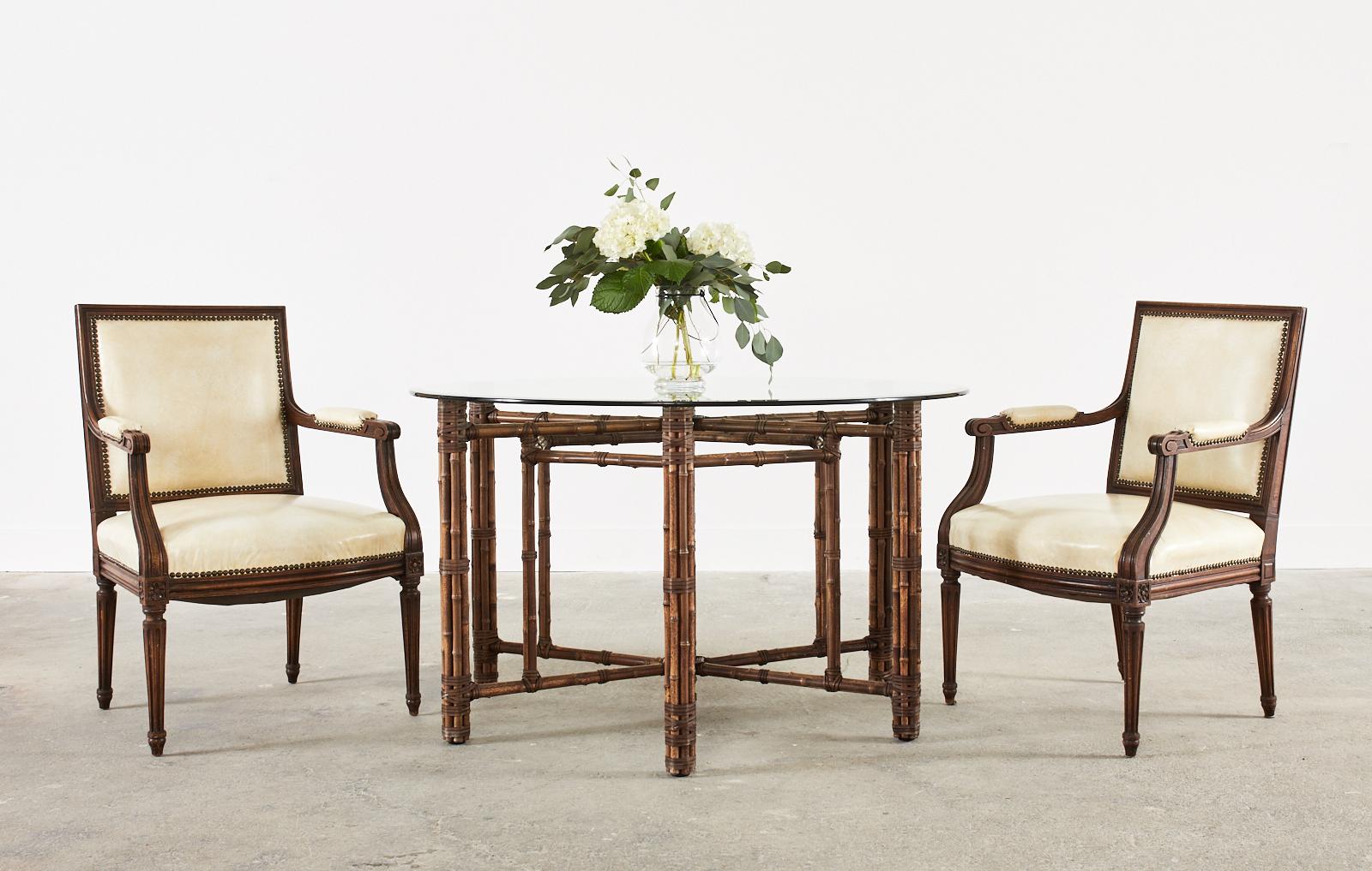 Magnificent set of four mahogany dining armchairs hand-crafted for the historic 19th century City of Paris department store in San Francisco, CA. Beautifully constructed in the grand French Louis XVI taste featuring hand carved frames with a