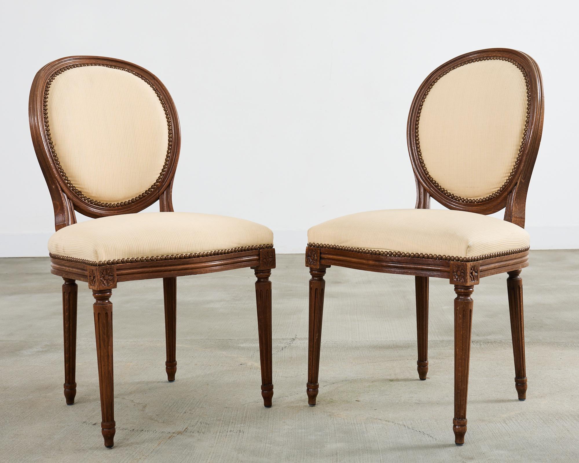Brass Set of Four French Louis XVI Style Oak Dining Chairs For Sale