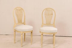 Set of Four French Louis XVI Style Painted Wood Balloon-Back Chairs