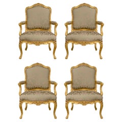 Set of Four French Mid-19th Century Louis XV Style Giltwood Armchairs