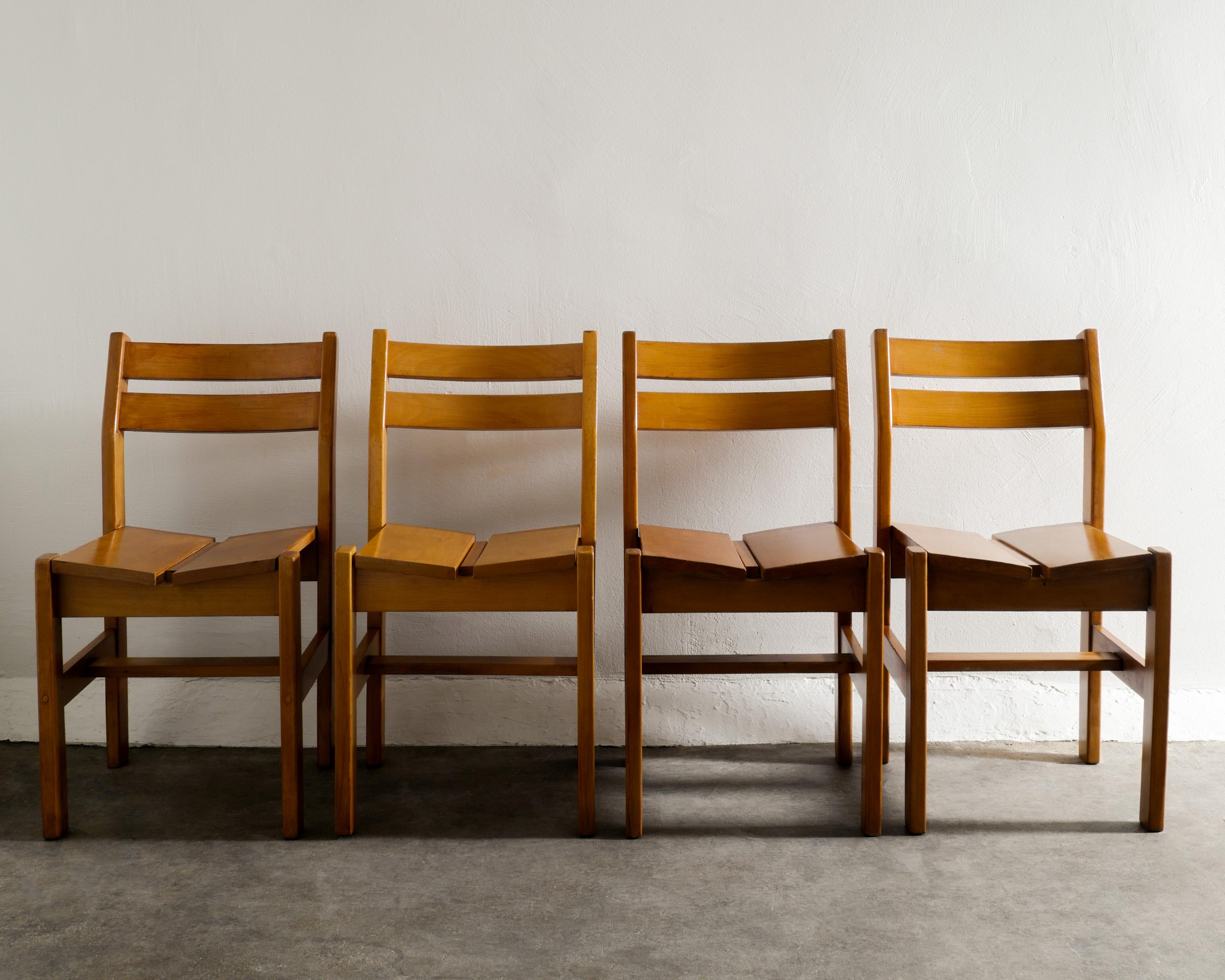 Rare set of four mid century dining chairs in elm wood by Charlotte Perriand produced for Les Arcs in France 1960s. In good original condition with matching patina. 

Dimensions: H: 31.11 in (79 cm) W: 16.15 in (41 cm) D: 17.72 in (45 cm) SH: 16.93