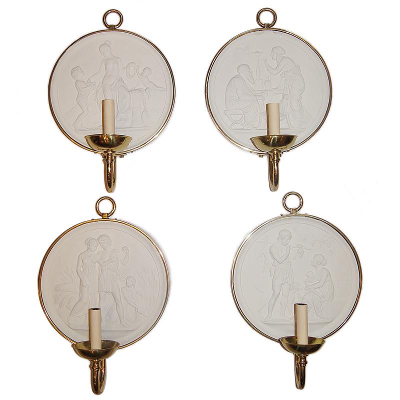 A set of four French circa 1920's neoclassic style sconces with Roman plaster plaques insets and gilt finish. Sold per pair.

Measurements:
Height: 17