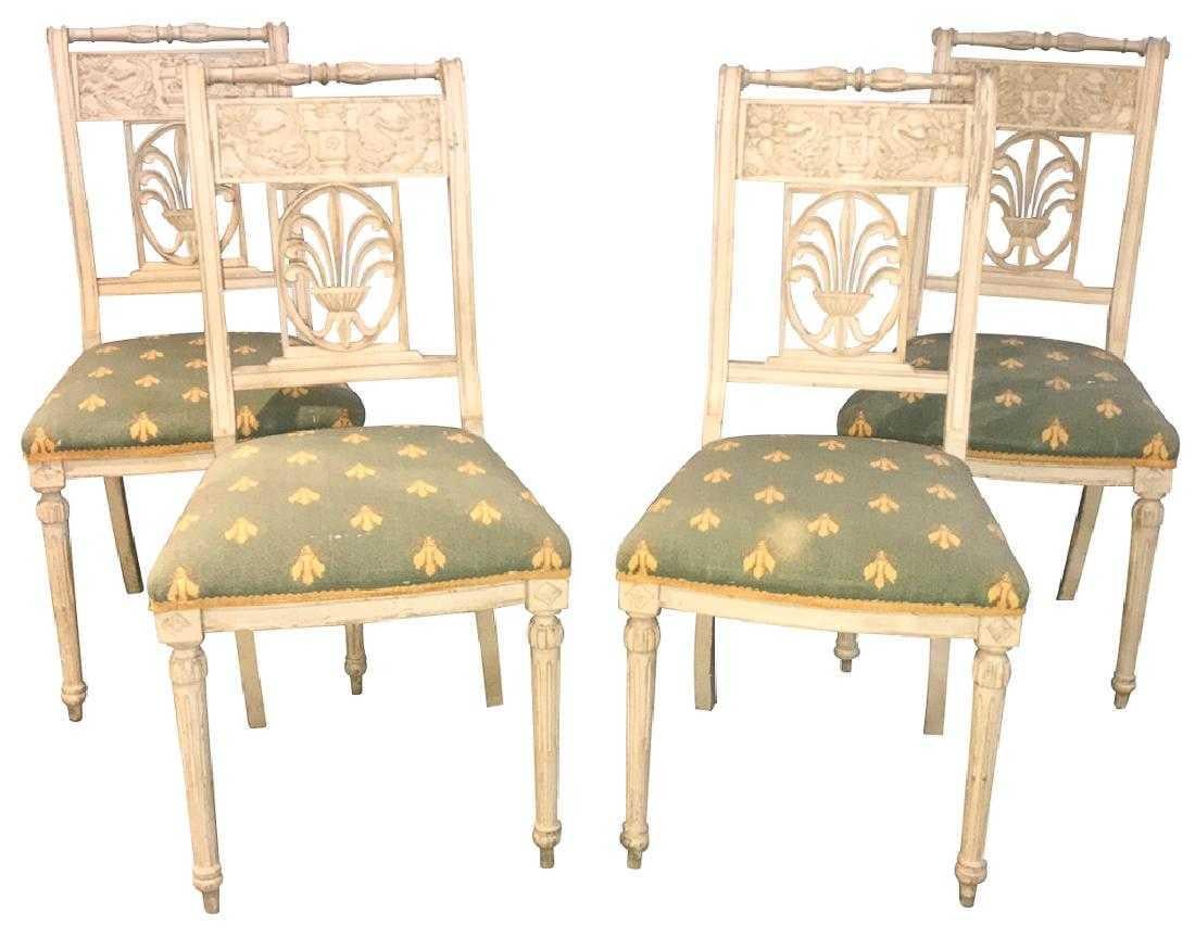 Great look!!

Set of four antique French neoclassical painted side chairs. The carved and turned crests atop carved splat backs having motifs of cornucopia, serpents, urns, and a central panel depicting carved stylized lilies. Each raised on