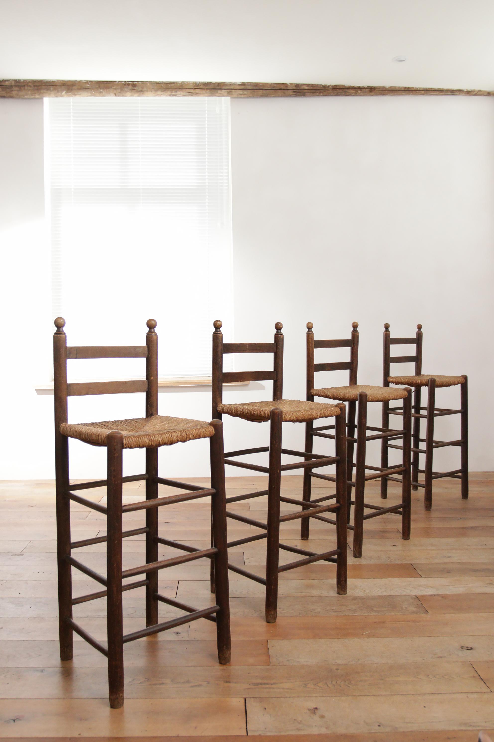 Set of Four French Oak Barstools with Rush Seats in Style of Charles Dudouyt 1