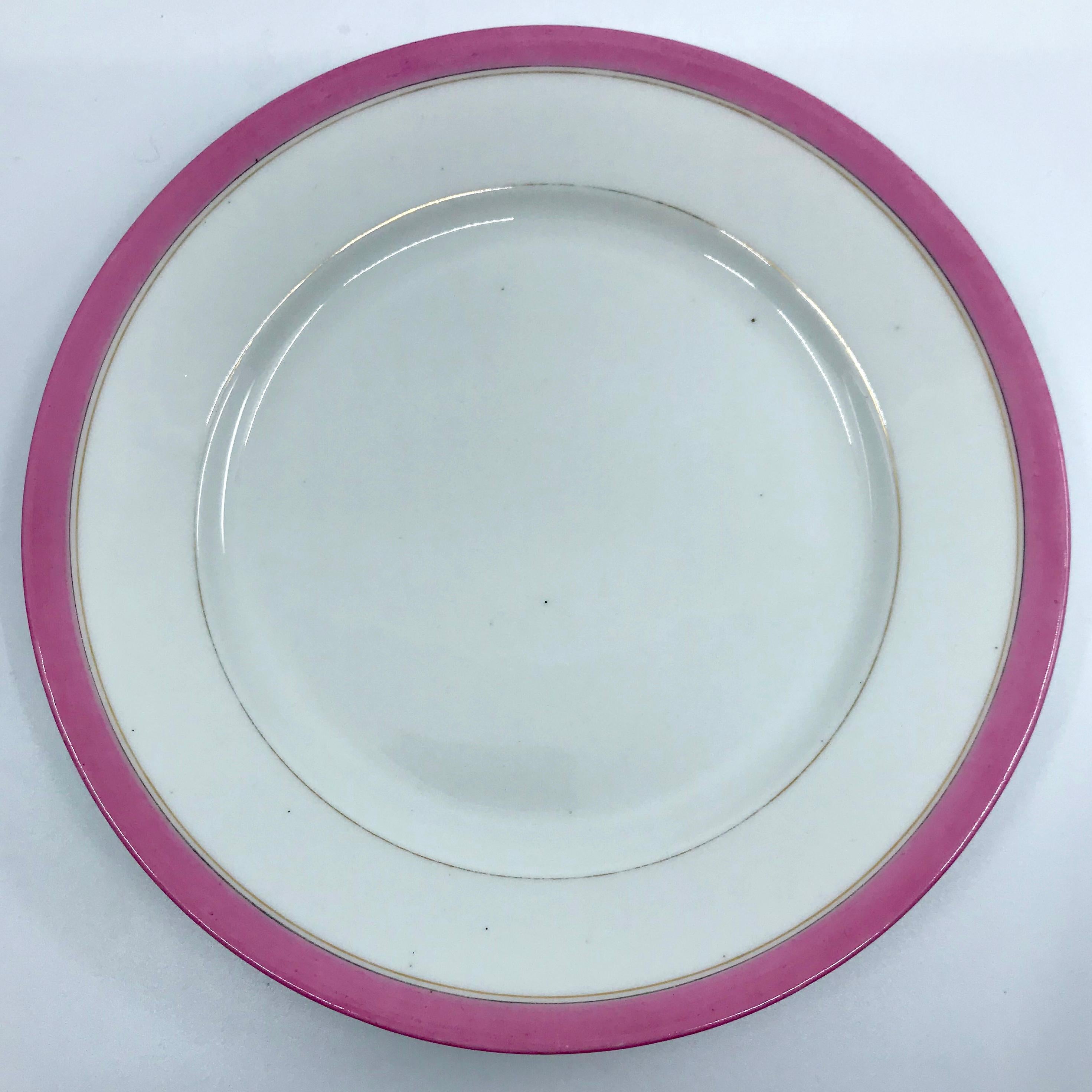 Porcelain Set of Four French Pink and Gilt Banded Plates For Sale
