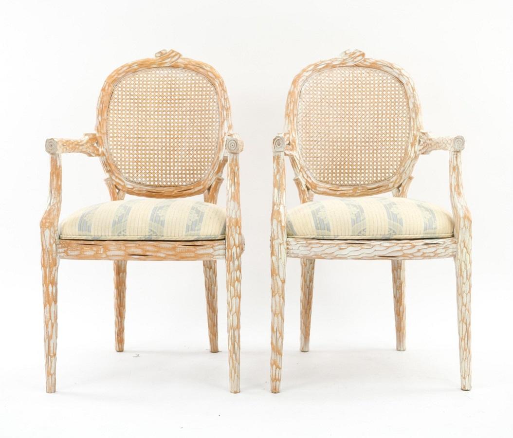 Set of four French style Cerused balloon back dining chairs. The chairs have caned backs and fabric covered seats.