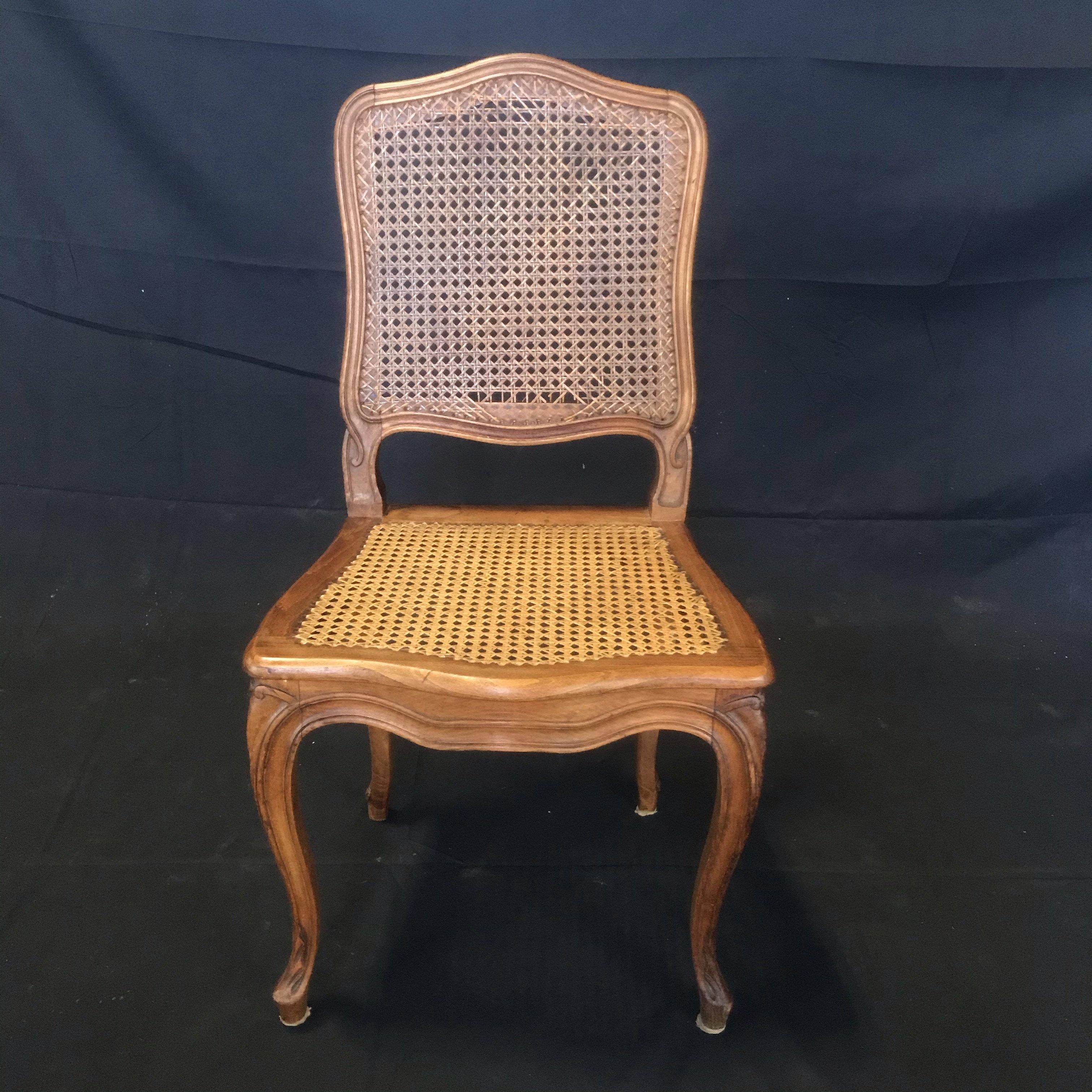 A beautiful set of four French Walnut Carved Cane Dining Chairs. Some damage to the caning (see photos) Priced accordingly
#4383