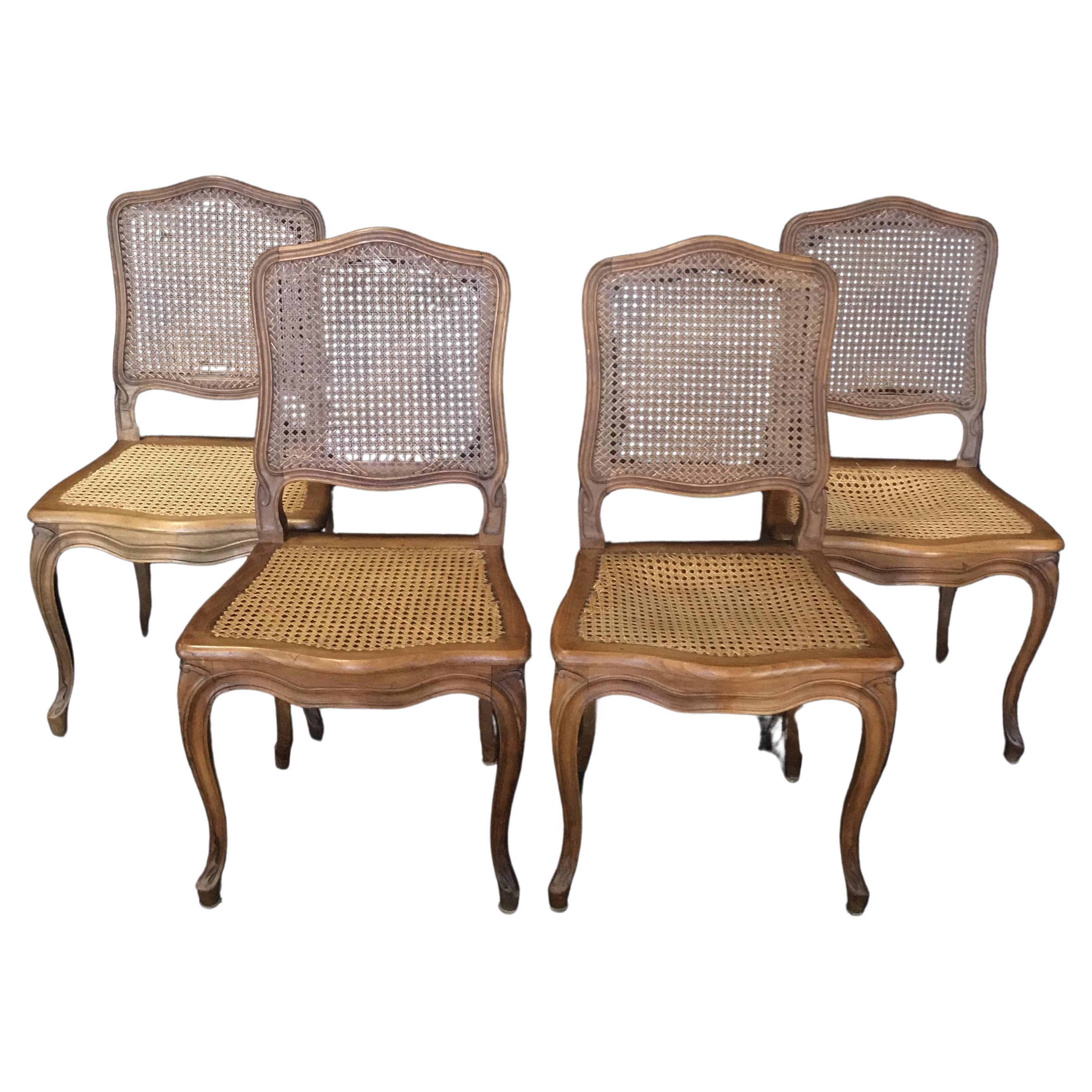 Set of Four French Walnut Carved Cane Dining Chairs For Sale