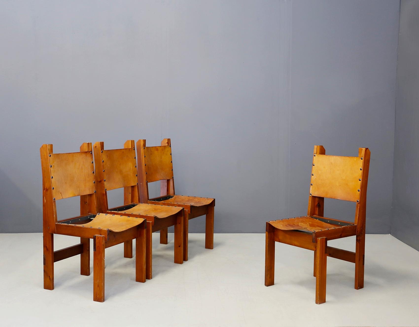 Set of 4 four French manufacture chairs from 1960. The set we propose is in the style of Pierre Chapo, for its cherrywood frame and leather seat and backrest. The particularity of the chairs is its leather upholstery sealed to the seat with large